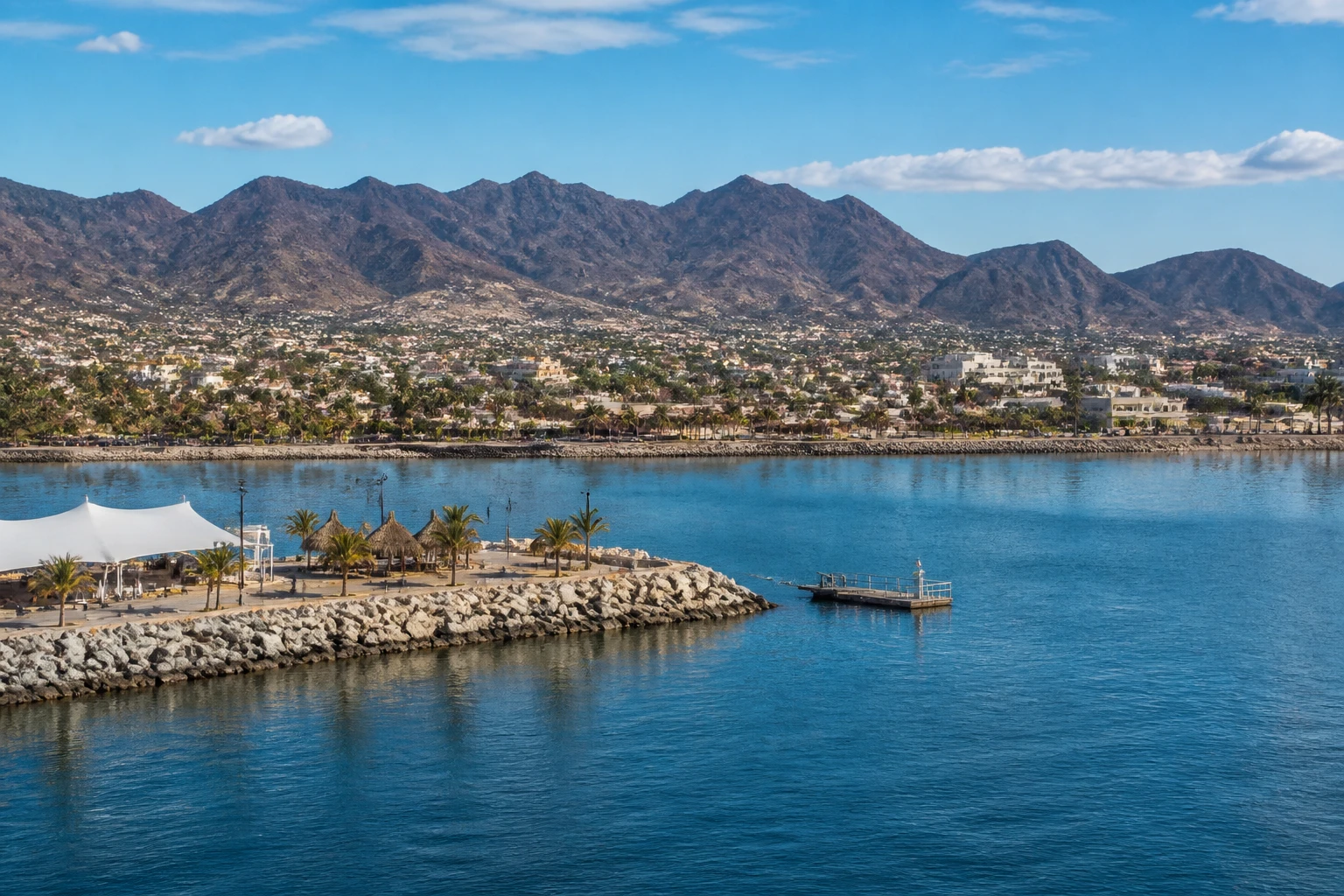 Representative cruise port destination view: La Paz, Mexico; passenger waterfront and harbor water, not an exact landmark photograph.