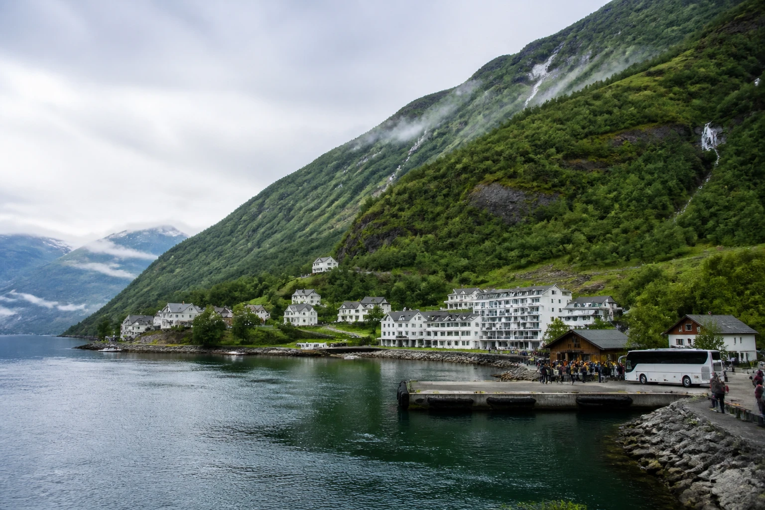 Representative cruise port destination view: Hellesylt, Norway; passenger waterfront and harbor water, not an exact landmark photograph.