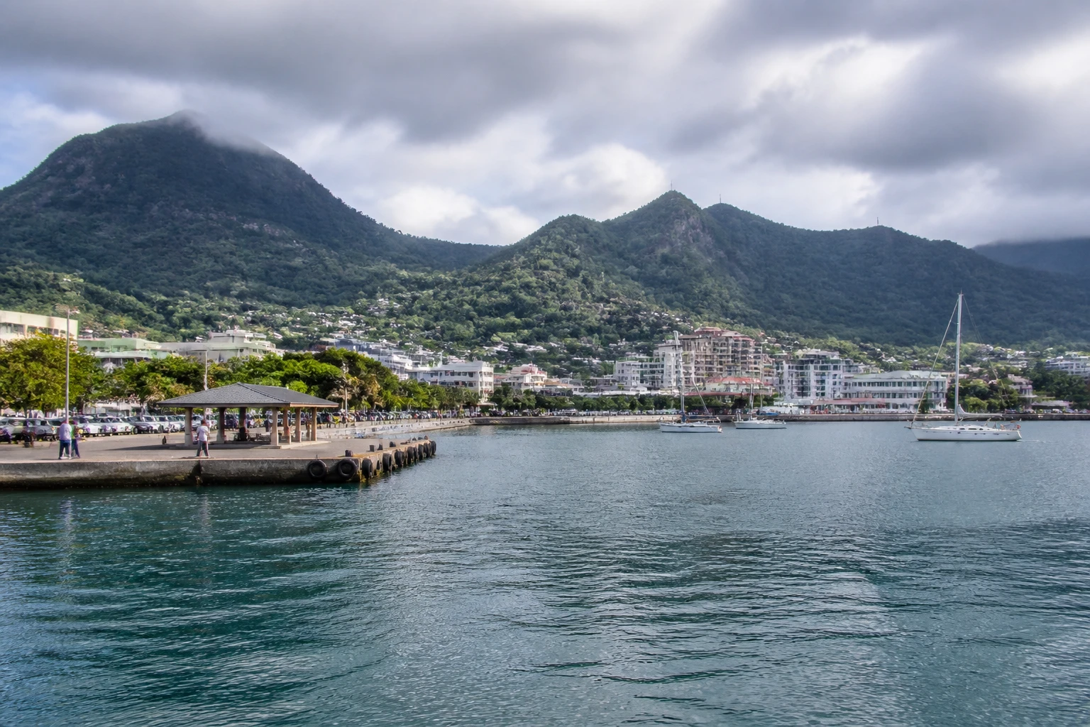 Representative cruise port destination view: Victoria, Mahé, Seychelles; passenger waterfront and harbor water, not an exact landmark photograph.