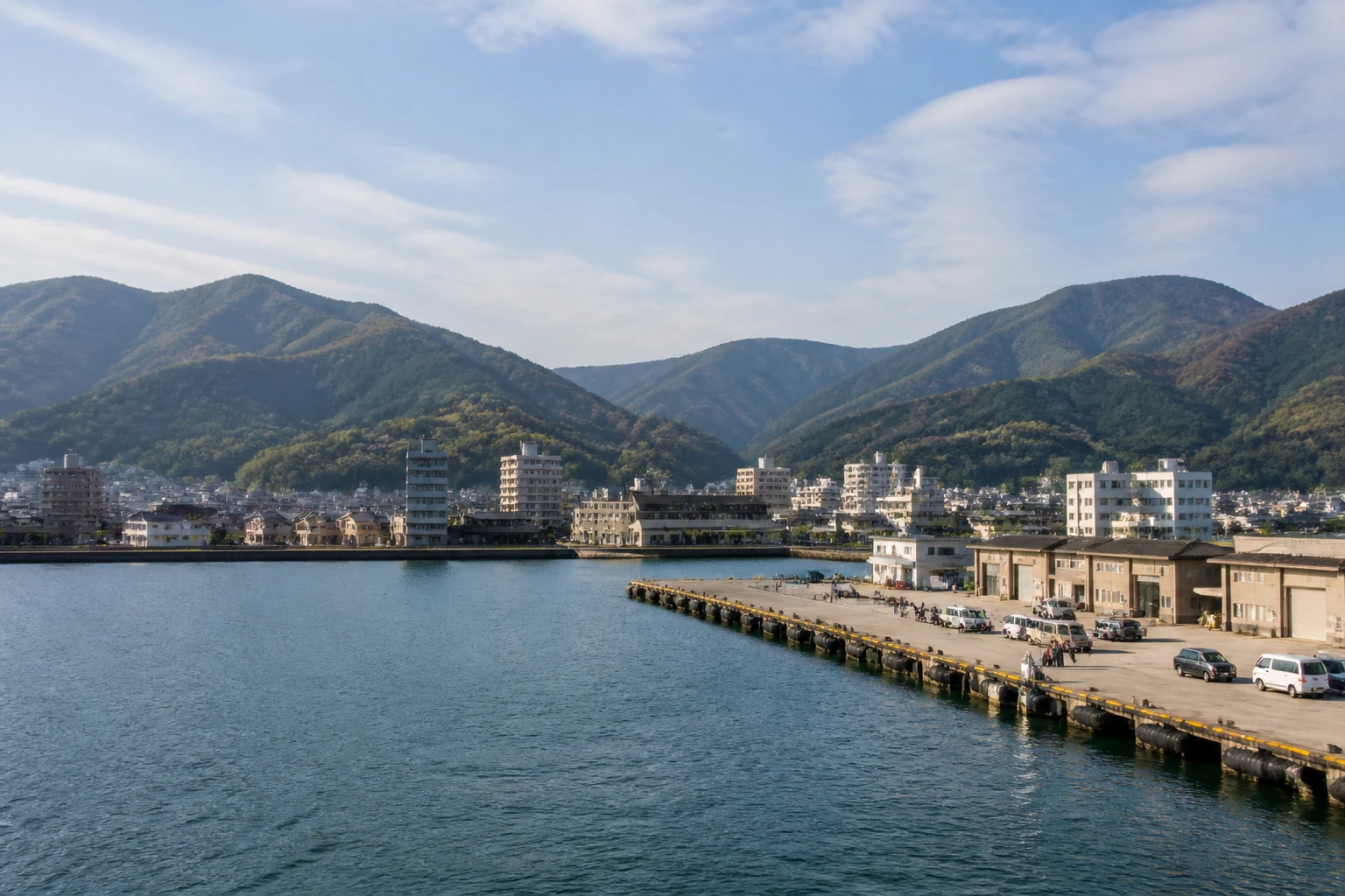 Representative cruise port destination view: Tsuruga, Japan; passenger waterfront and harbor water, not an exact landmark photograph.