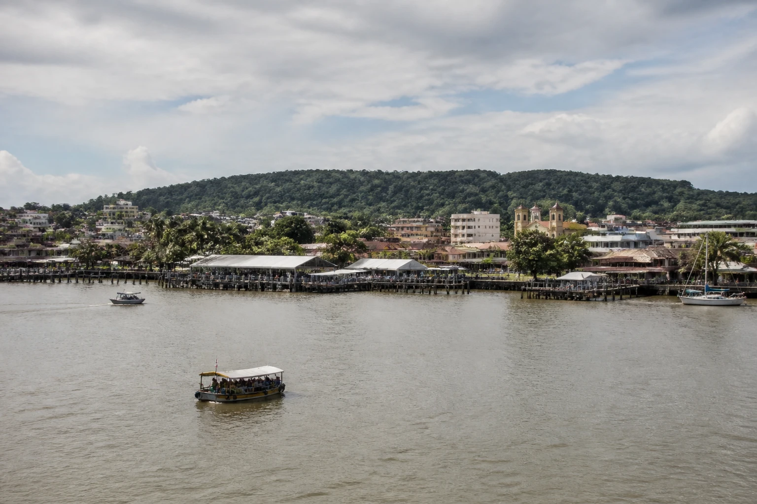 Representative cruise port destination view: Îles du Salut, French Guiana; passenger waterfront and harbor water, not an exact landmark photograph.