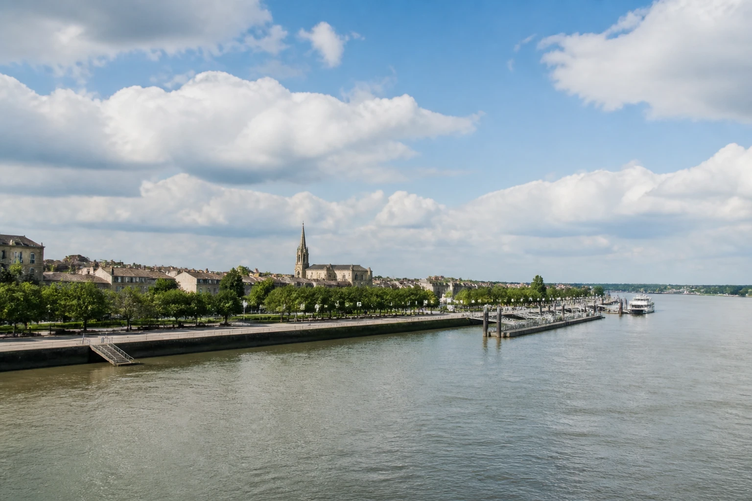 Representative cruise port destination view: Pauillac, France; passenger waterfront and harbor water, not an exact landmark photograph.