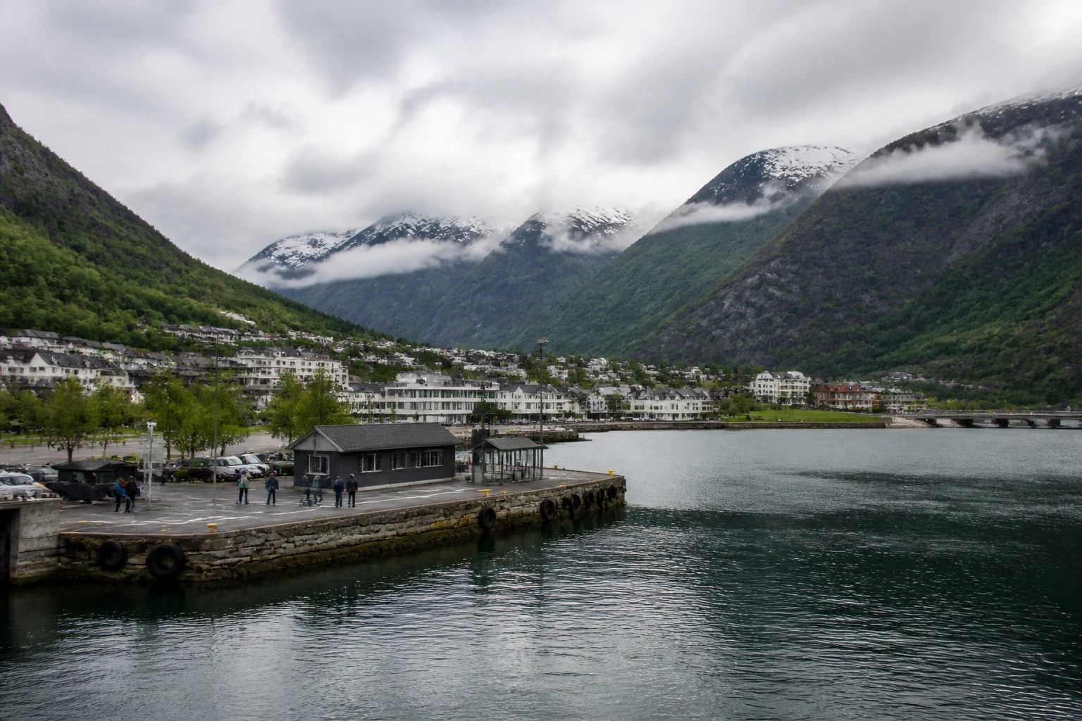 Representative cruise port destination view: Odda, Norway; passenger waterfront and harbor water, not an exact landmark photograph.