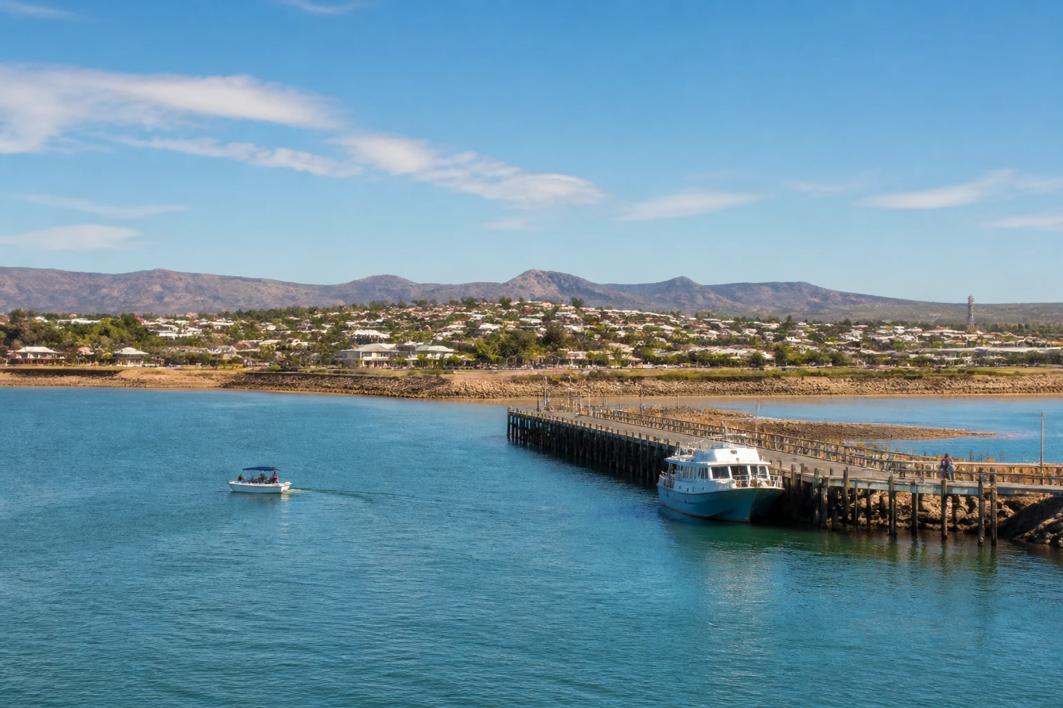 Representative cruise port destination view: Exmouth, Australia; passenger waterfront and harbor water, not an exact landmark photograph.