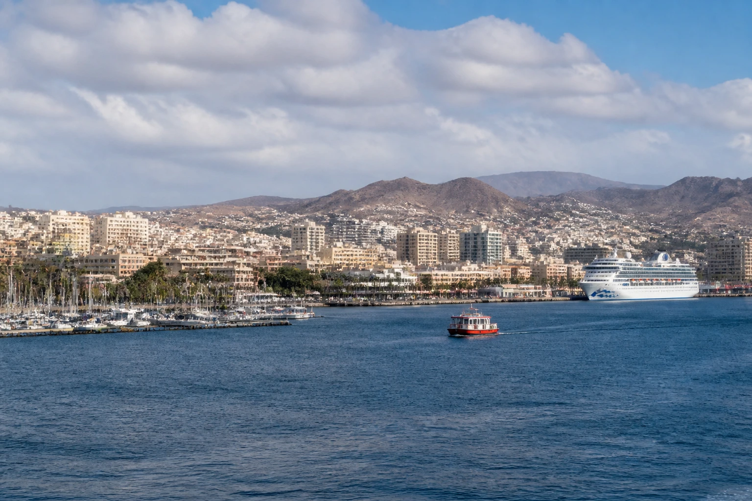 Representative cruise port destination view: Las Palmas, Spain; passenger waterfront and harbor water, not an exact landmark photograph.