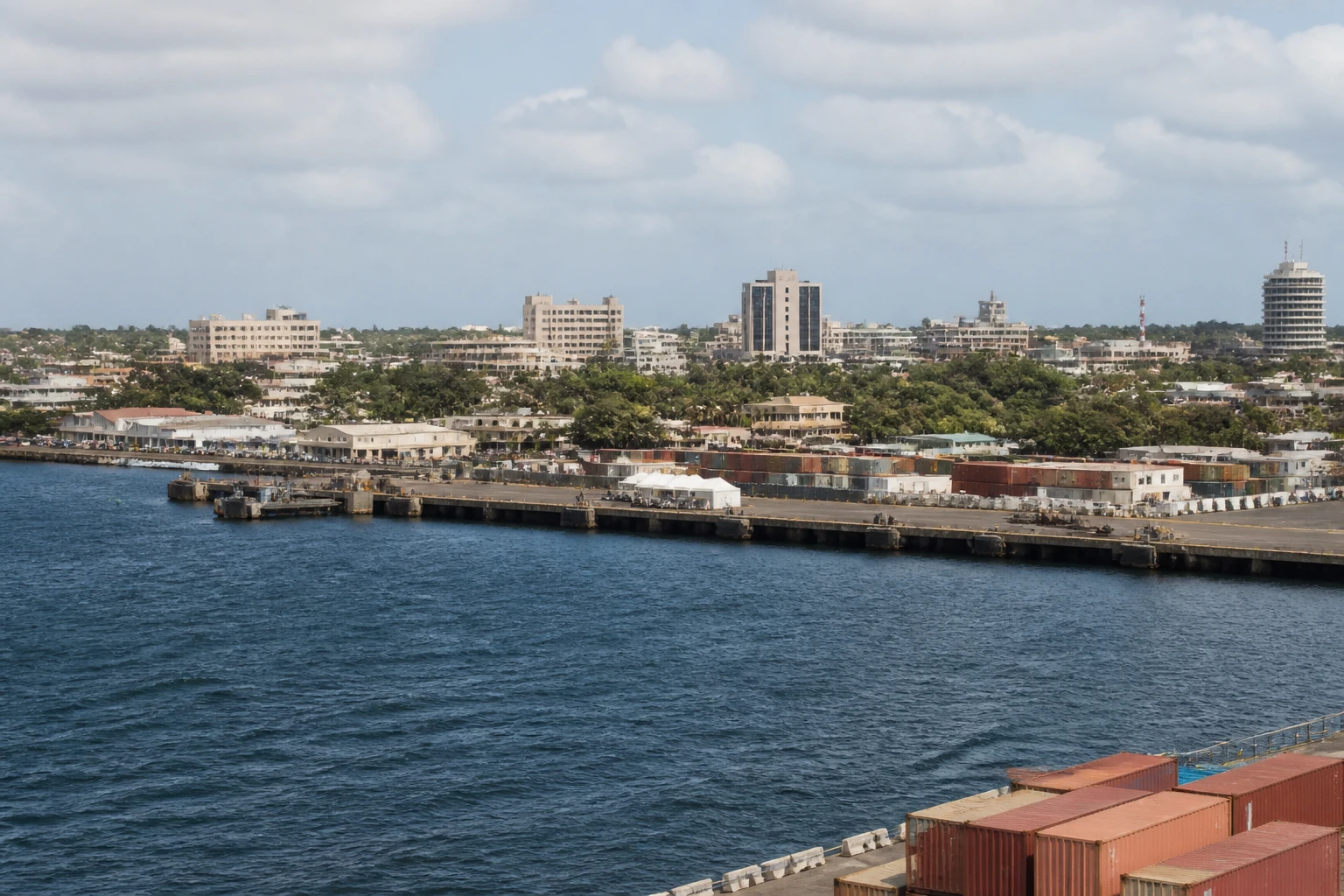 Representative cruise port destination view: Lomé, Togo; passenger waterfront and harbor water, not an exact landmark photograph.