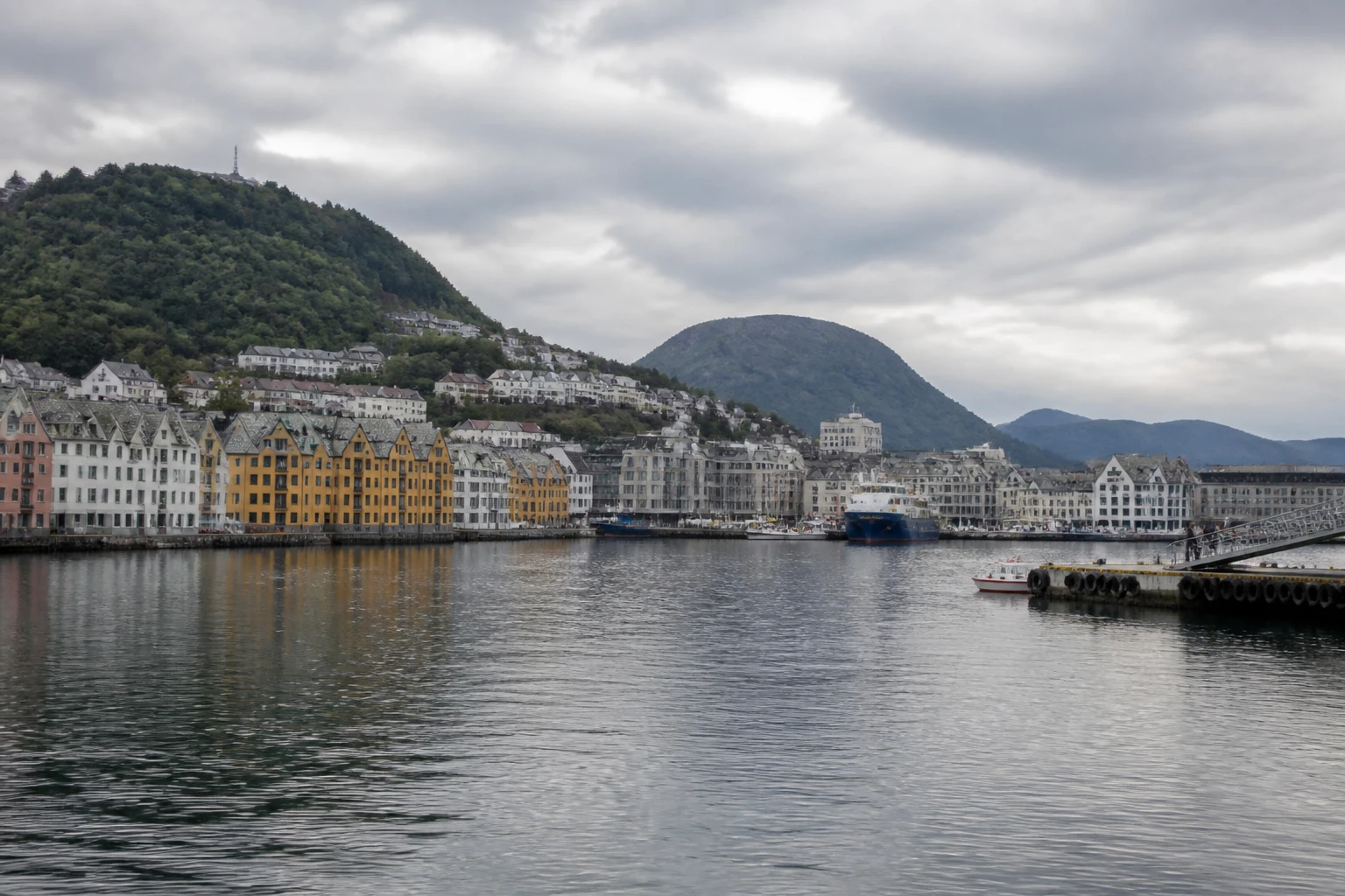 Representative cruise port destination view: Ålesund, Norway; passenger waterfront and harbor water, not an exact landmark photograph.