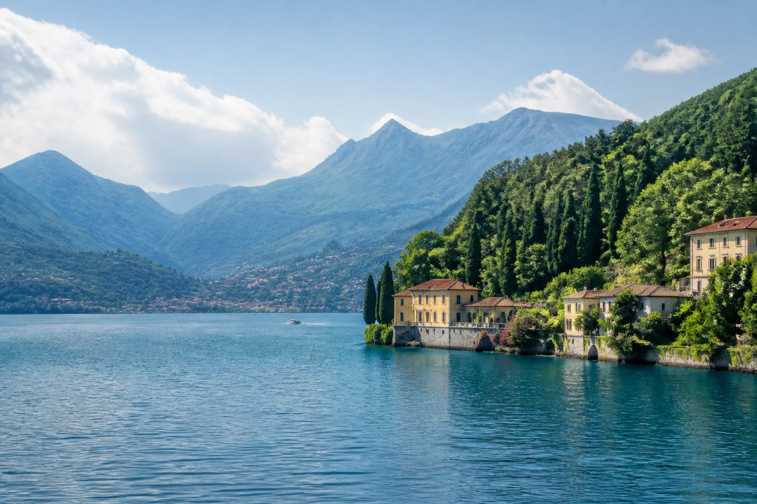 Representative lake destination view: Lake Como, Italy; inland water, regional terrain, and vegetation, not an exact landmark photograph.