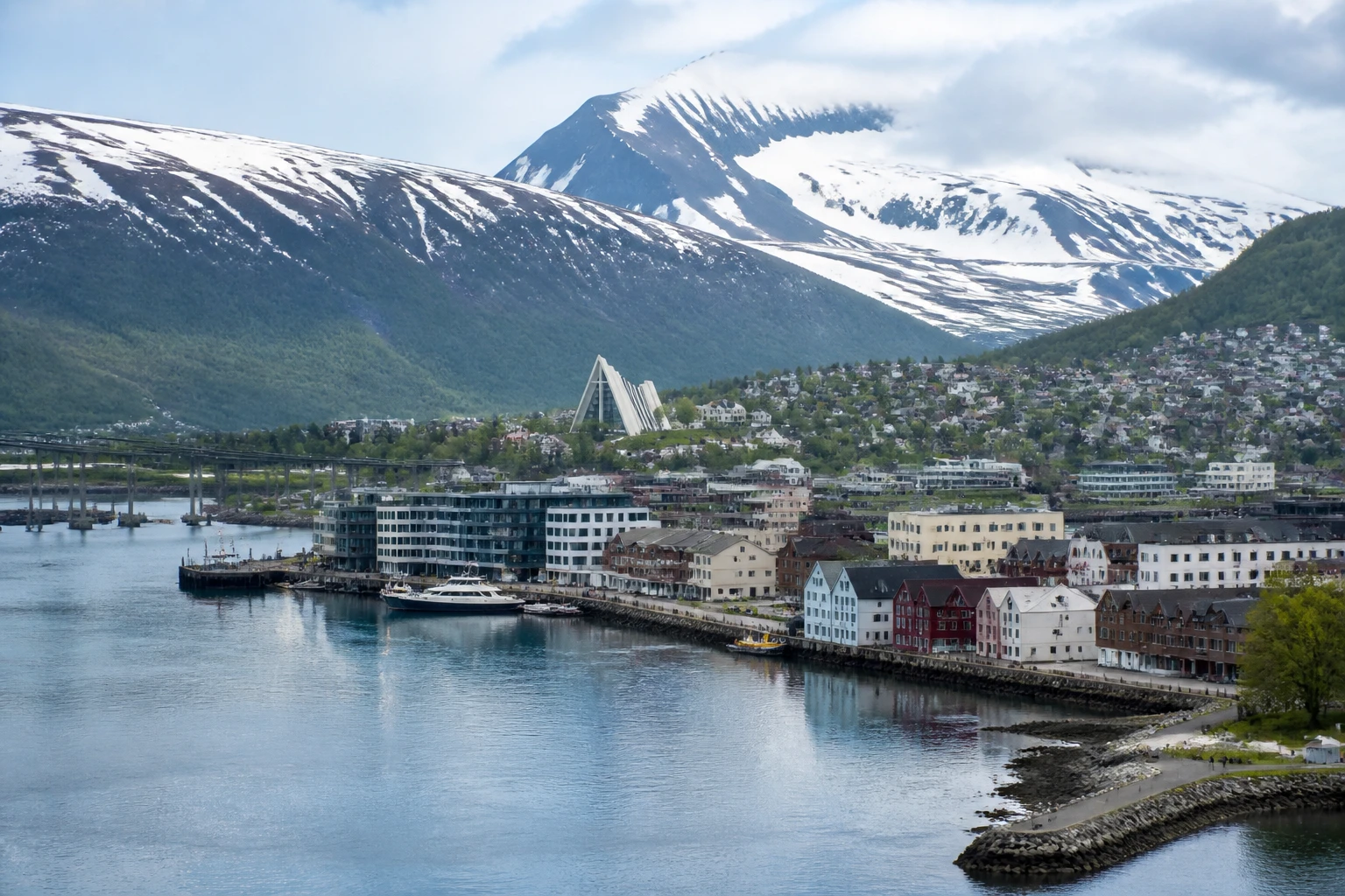 Representative arctic destination view: Tromso, Norway; Arctic terrain and seasonally plausible light, not an exact landmark photograph.