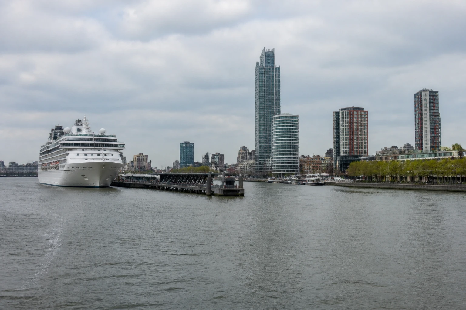 Representative cruise port destination view: Rotterdam, Netherlands; passenger waterfront and harbor water, not an exact landmark photograph.