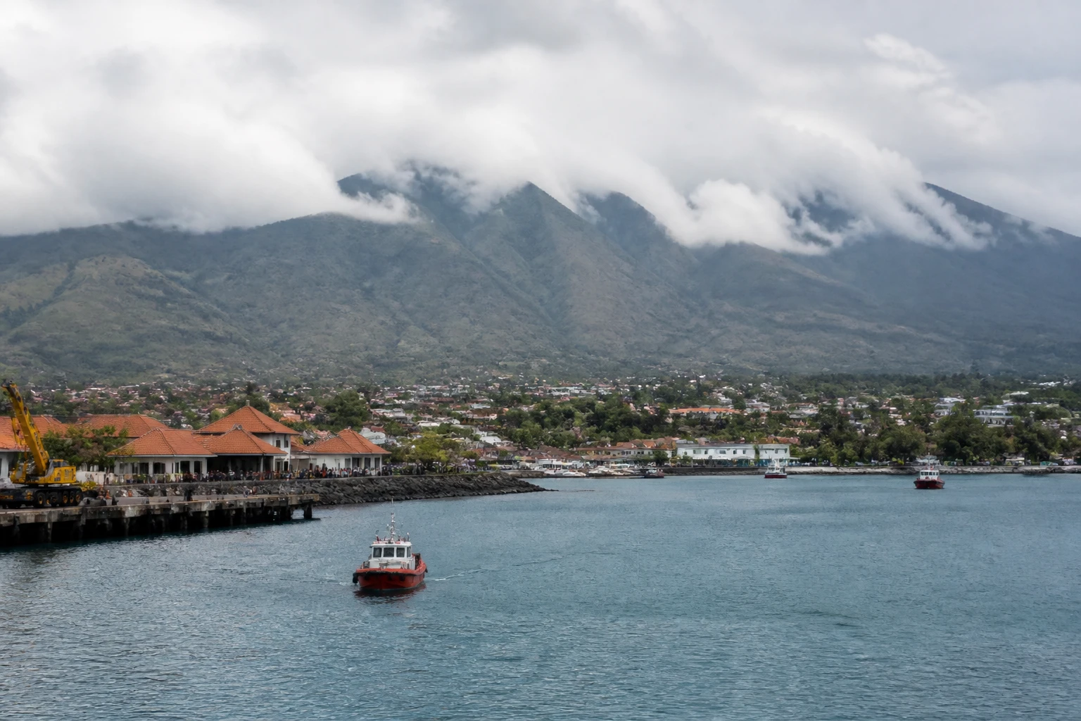 Representative cruise port destination view: Celukan Bawang, Indonesia; passenger waterfront and harbor water, not an exact landmark photograph.