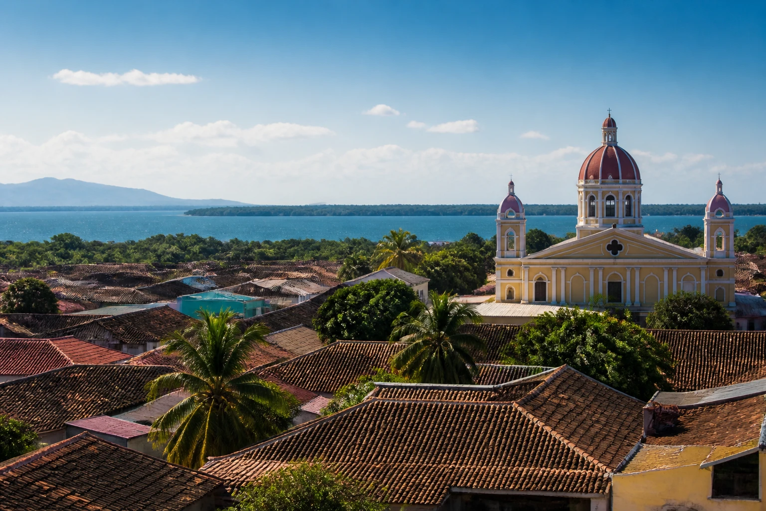 Representative lake destination view: Granada, Nicaragua; inland water, regional terrain, and vegetation, not an exact landmark photograph.
