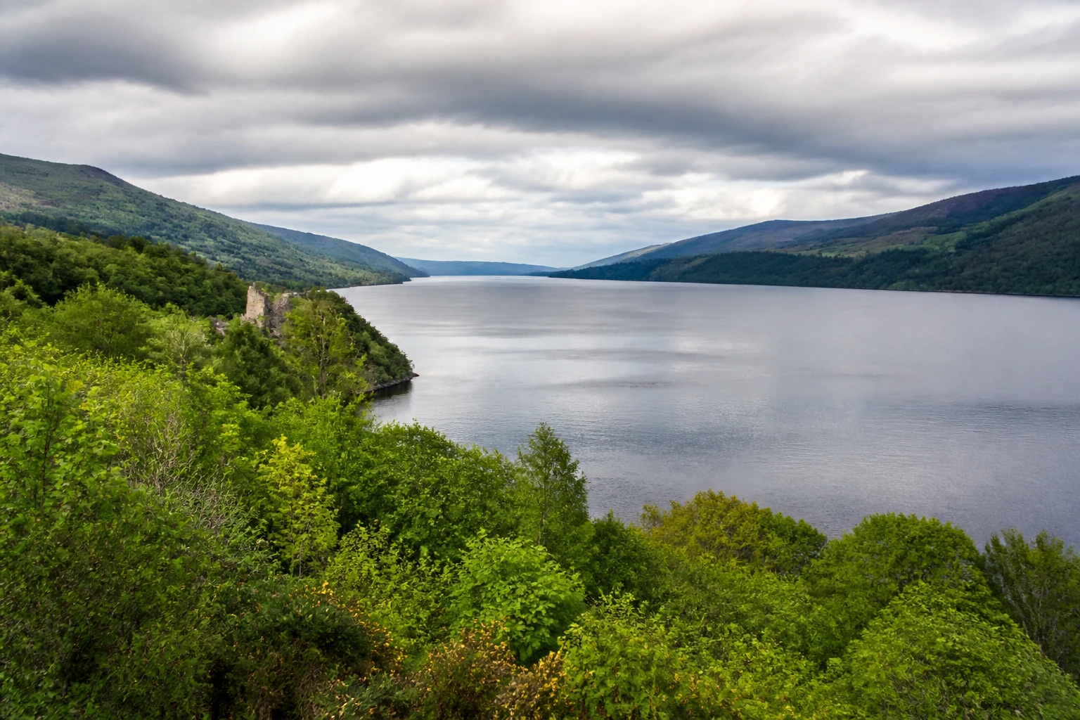 Representative nature destination view: Inverness and Loch Ness, United Kingdom; regional terrain and vegetation, not an exact landmark photograph.