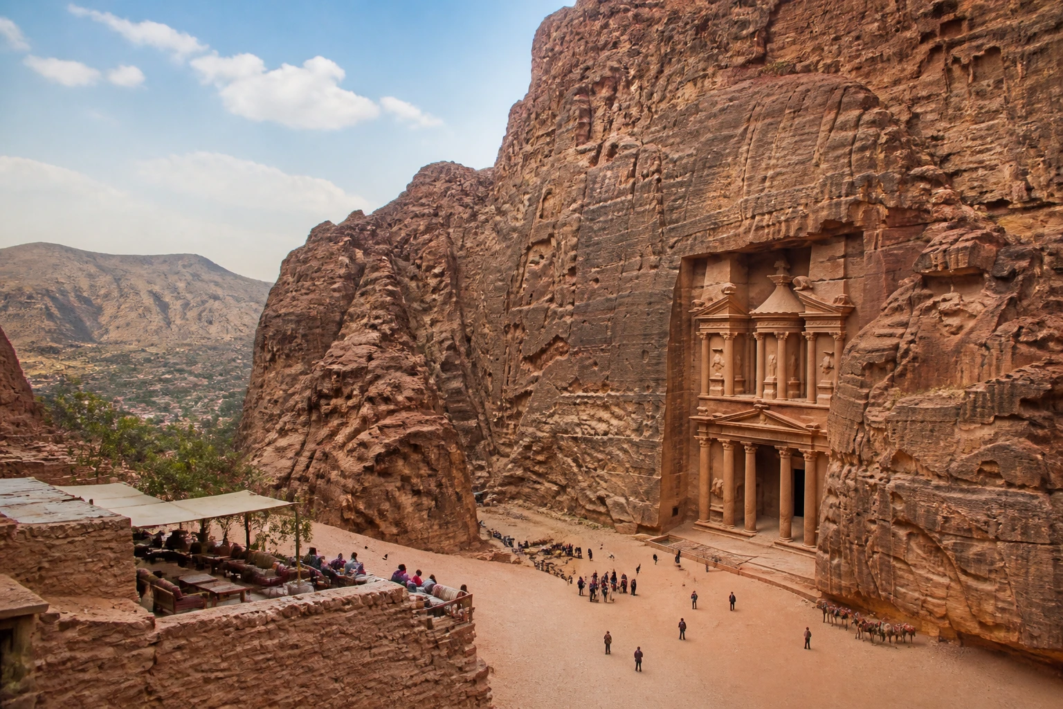 Representative travel destination view: Petra, Jordan; heritage-scale streetscape and regional architecture, not an exact landmark photograph.