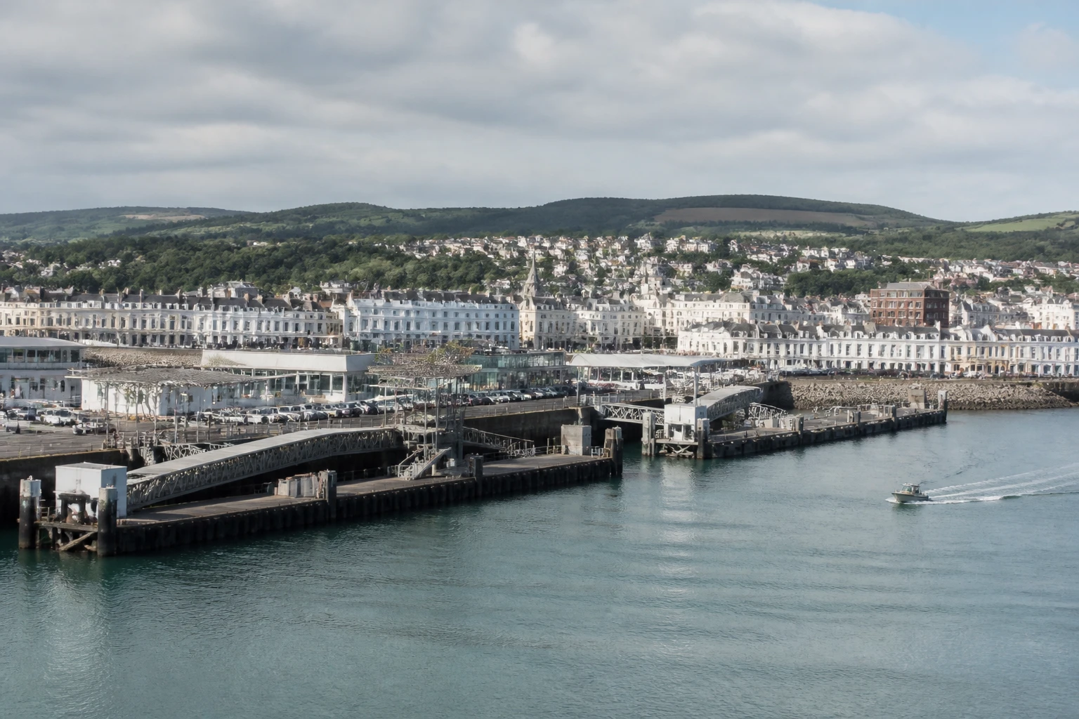 Representative cruise port destination view: Douglas, Isle of Man; passenger waterfront and harbor water, not an exact landmark photograph.