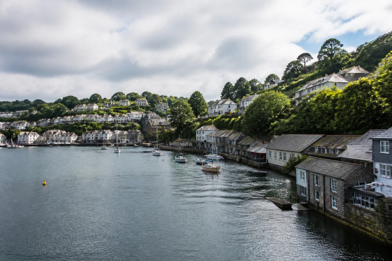 Representative cruise port destination view: Fowey, United Kingdom; passenger waterfront and harbor water, not an exact landmark photograph.