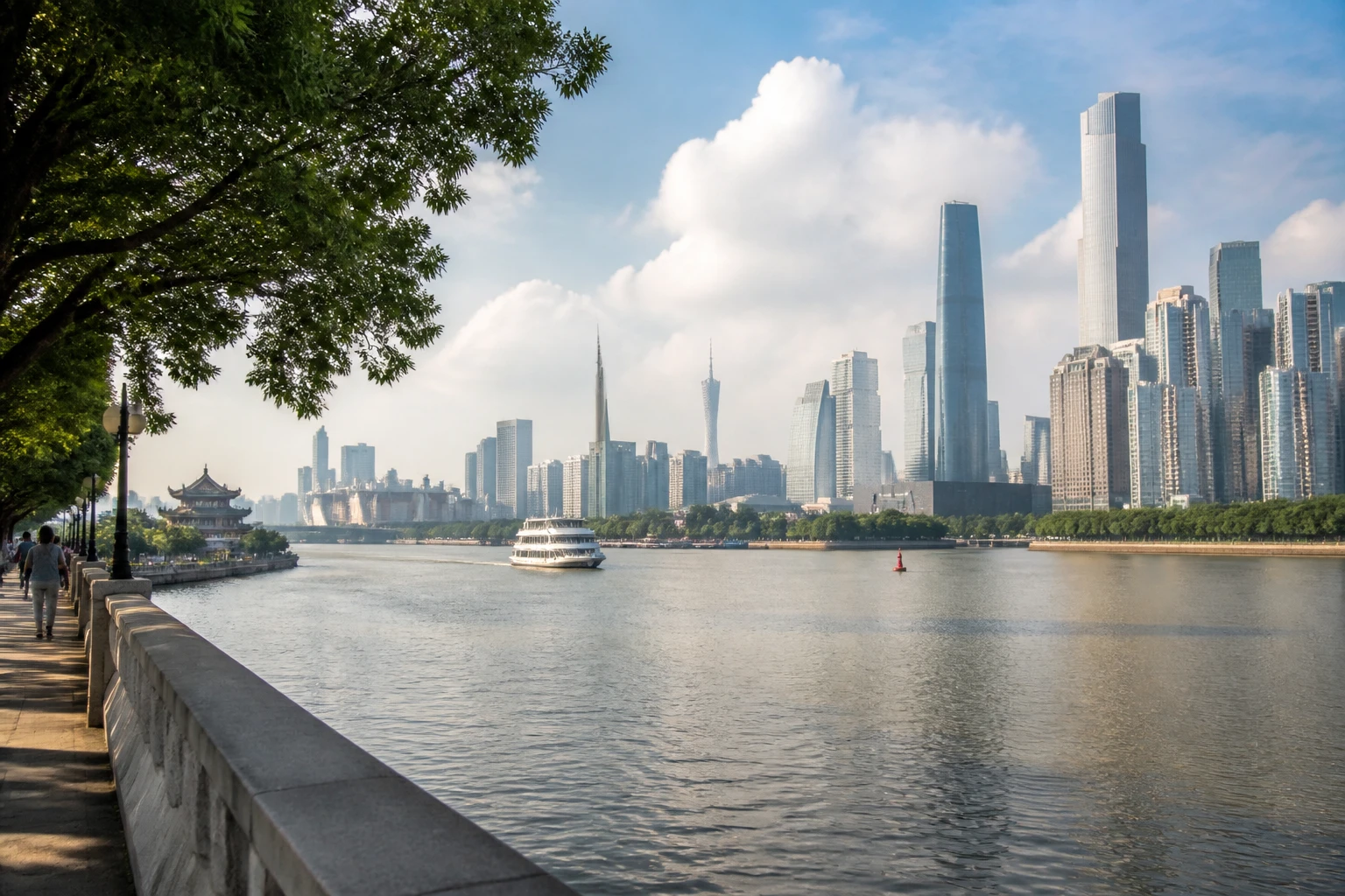 Representative river destination view: Guangzhou, China; inland water, regional terrain, and vegetation, not an exact landmark photograph.