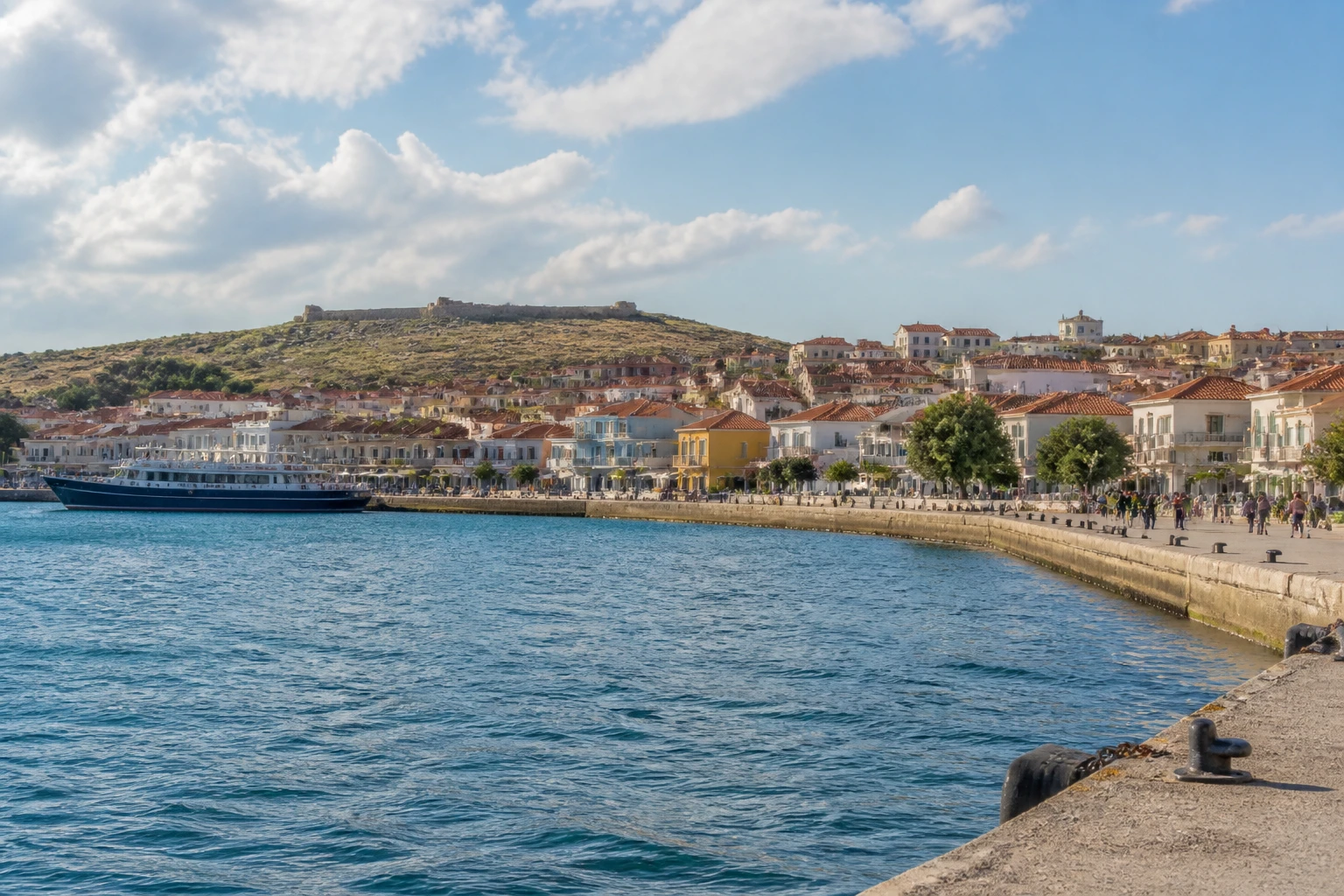 Representative cruise port destination view: Bozcaada, Turkiye; passenger waterfront and harbor water, not an exact landmark photograph.