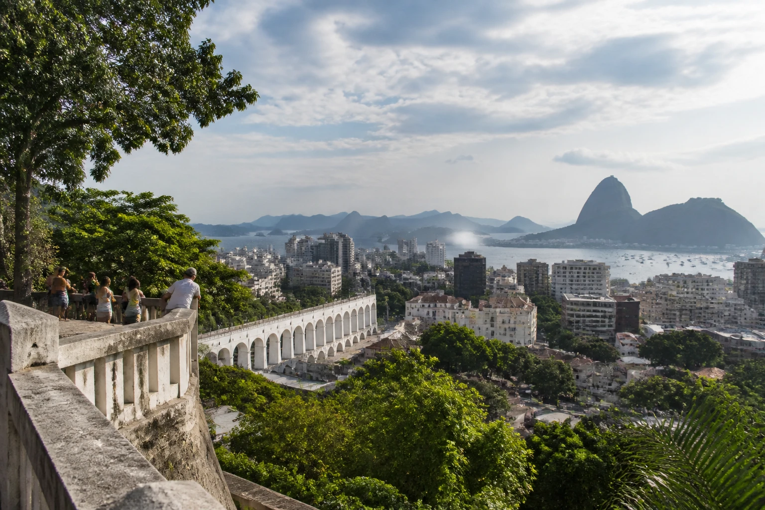 Representative city destination view: Rio de Janeiro, Brazil; passenger waterfront and harbor water, not an exact landmark photograph.