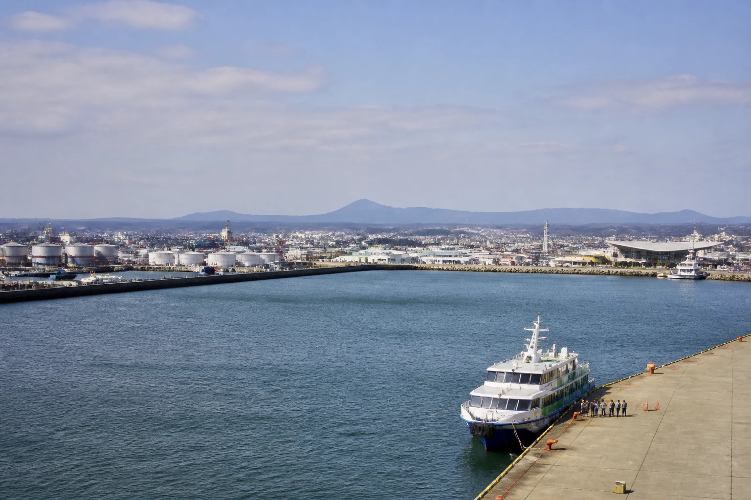 Representative cruise port destination view: Hitachinaka, Japan; passenger waterfront and harbor water, not an exact landmark photograph.