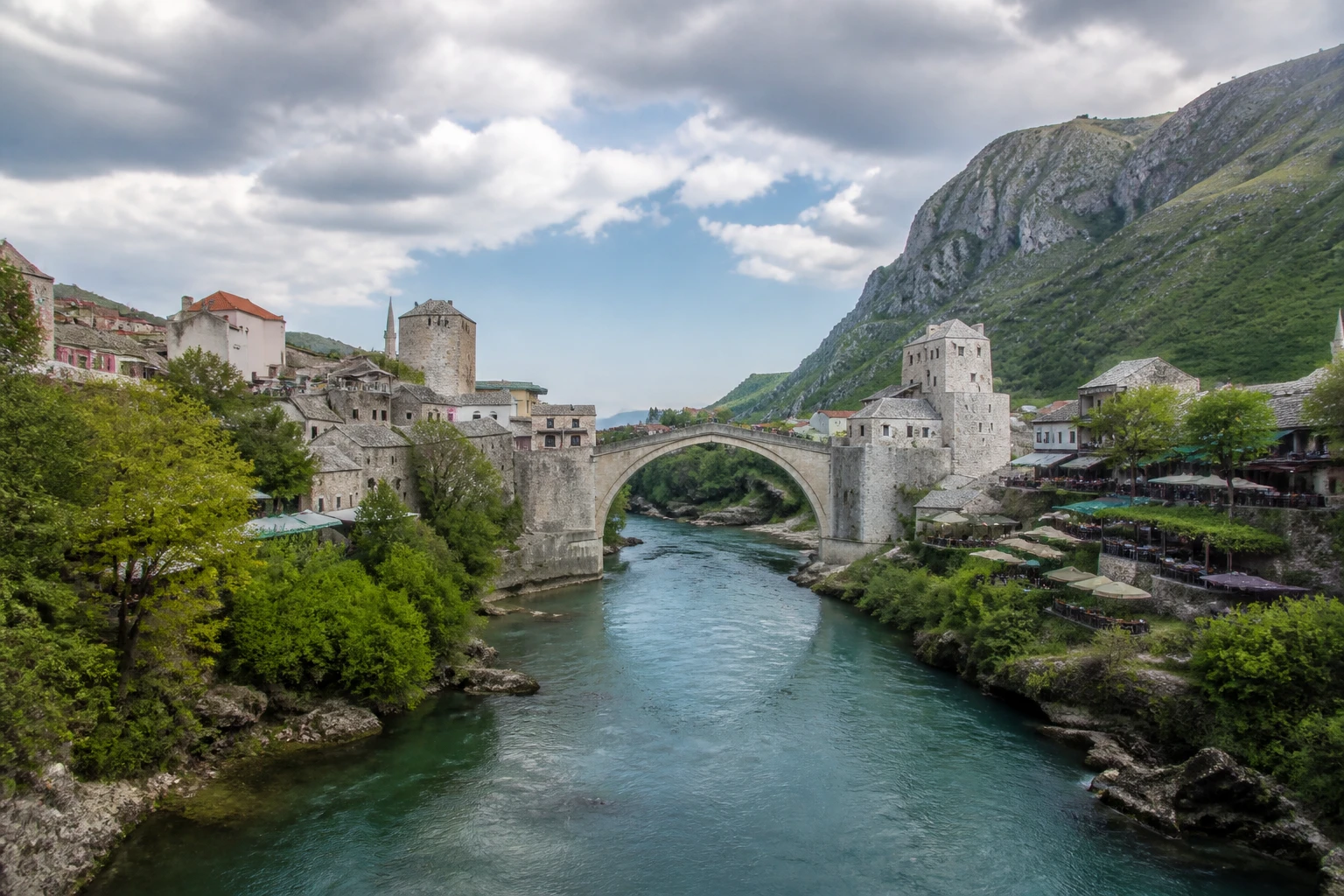 Representative historic city destination overview of Mostar in Bosnia and Herzegovina, showing heritage-scale streetscape, regional architecture, and natural light rather than an exact landmark view.
