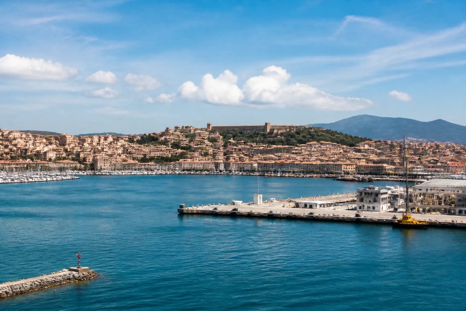 Representative cruise port destination view: Piombino, Italy; passenger waterfront and harbor water, not an exact landmark photograph.