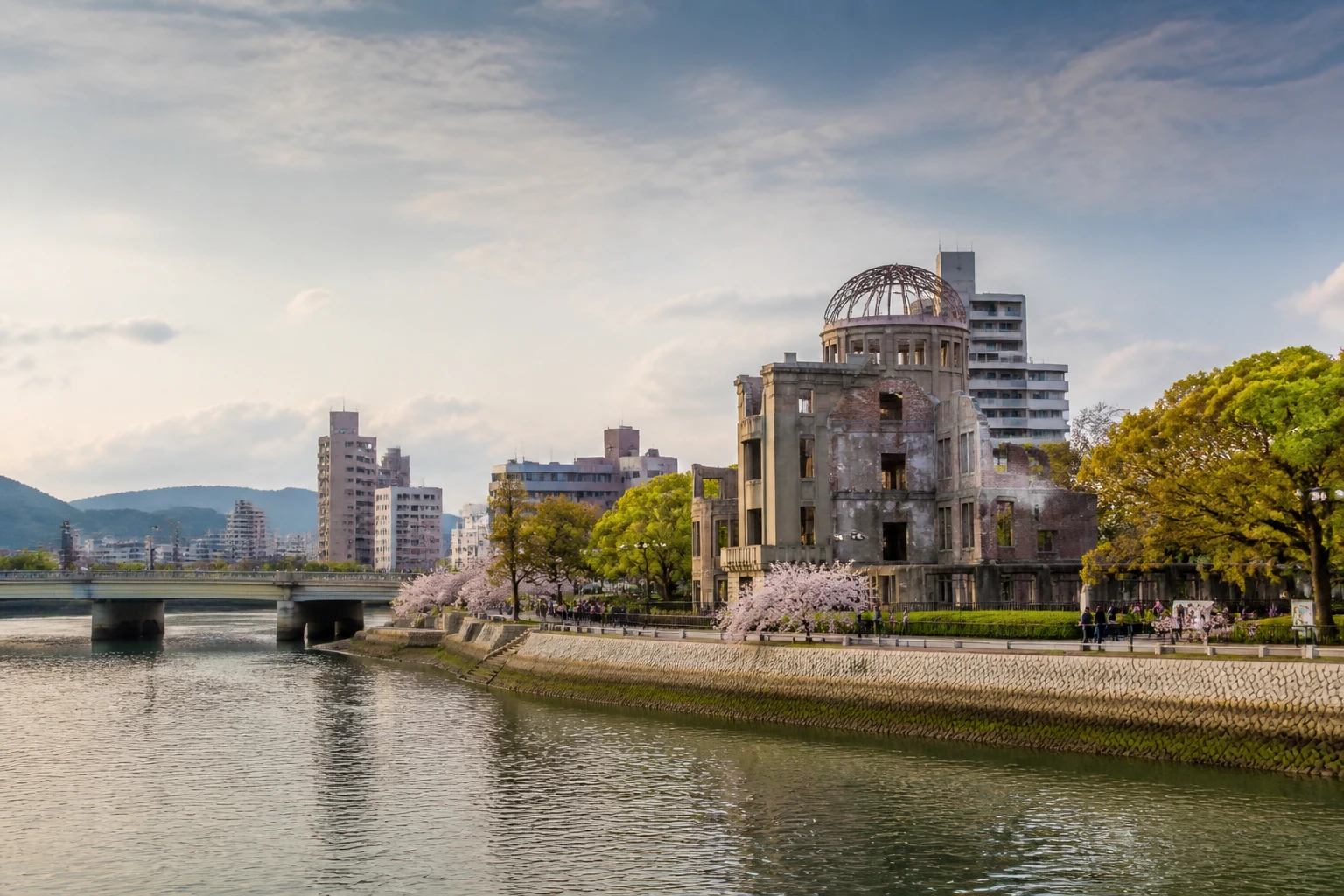 Representative historic city destination view: Hiroshima, Japan; passenger waterfront and harbor water, not an exact landmark photograph.