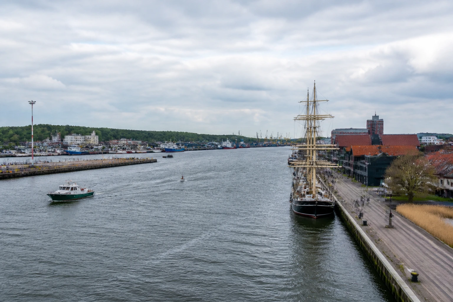Representative cruise port destination view: Klaipeda, Lithuania; passenger waterfront and harbor water, not an exact landmark photograph.