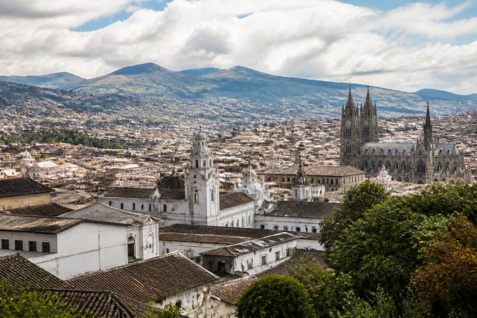 Representative historic city destination view: Quito, Ecuador; heritage-scale streetscape and regional architecture, not an exact landmark photograph.