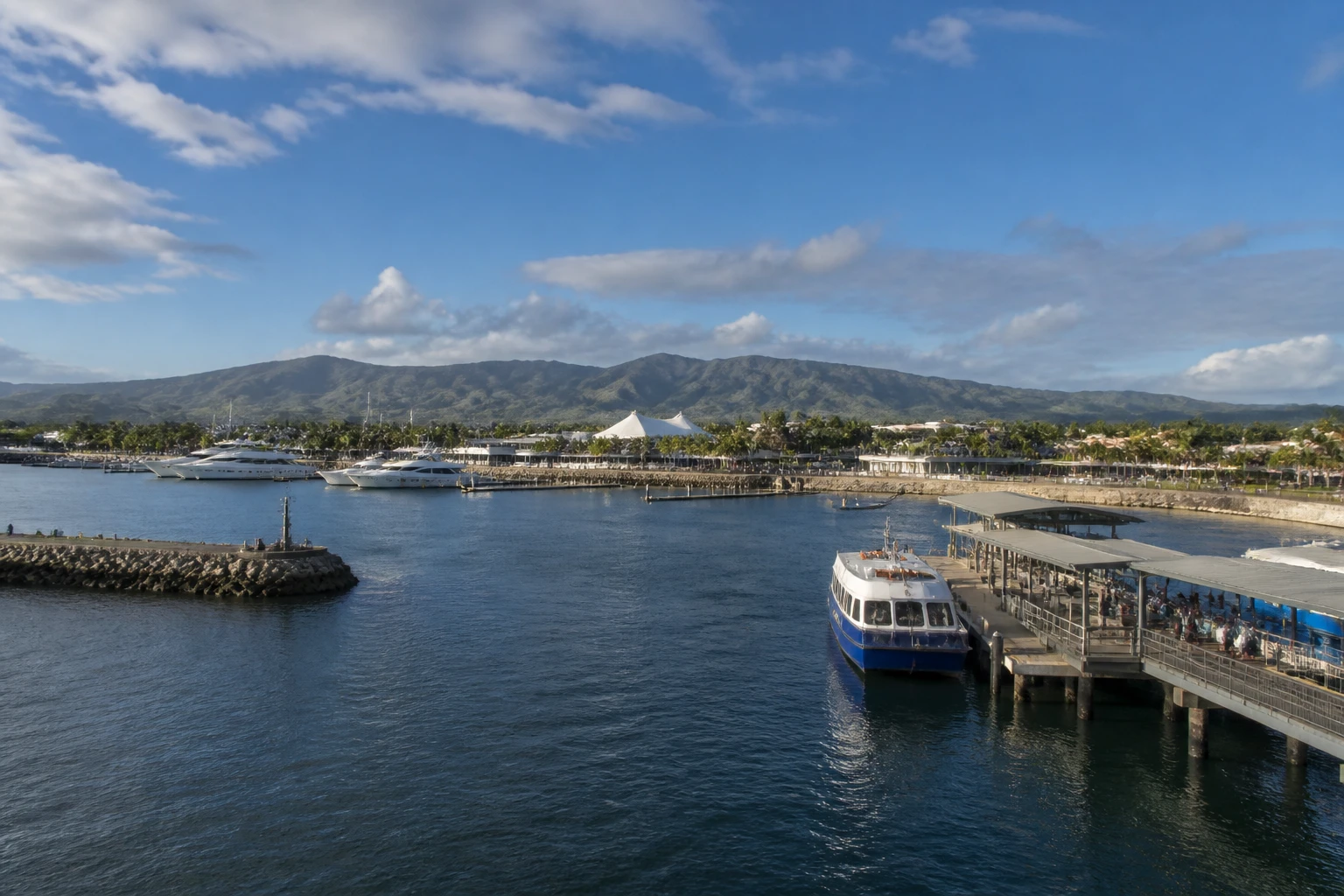 Representative cruise port destination view: Port Denarau, Fiji; passenger waterfront and harbor water, not an exact landmark photograph.