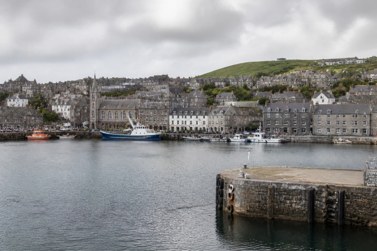 Representative cruise port destination view: Lerwick, United Kingdom; passenger waterfront and harbor water, not an exact landmark photograph.