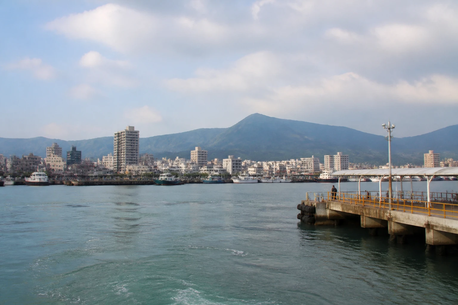 Representative cruise port destination view: Taichung, Taiwan; passenger waterfront and harbor water, not an exact landmark photograph.
