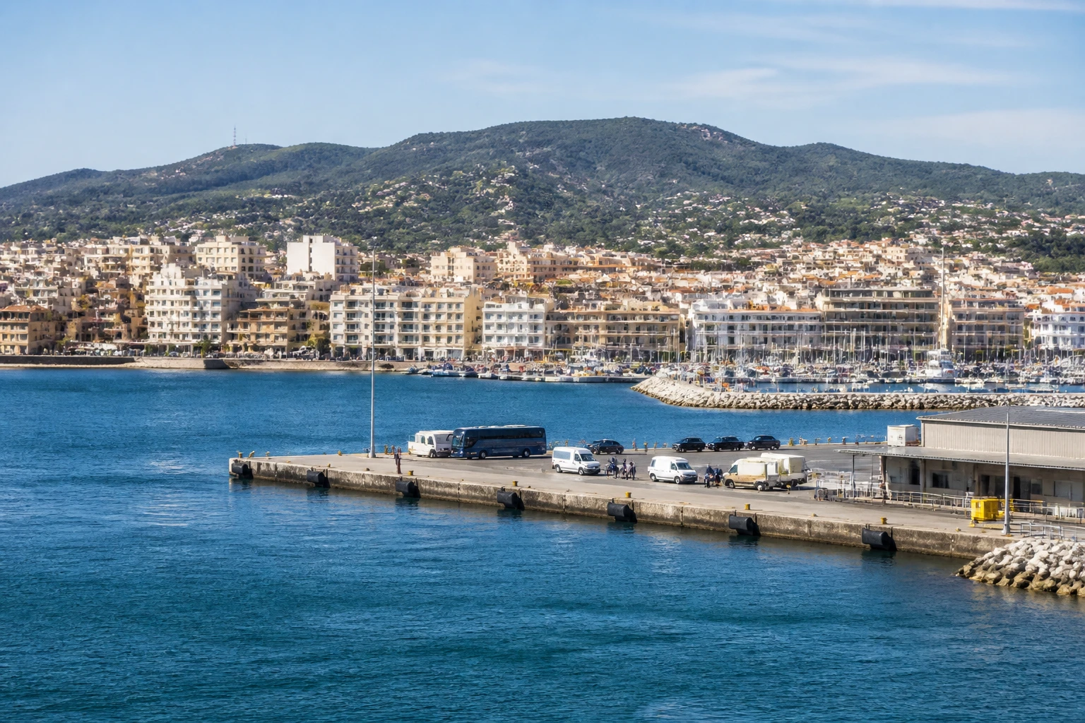 Representative cruise port destination view: Palamos, Spain; passenger waterfront and harbor water, not an exact landmark photograph.