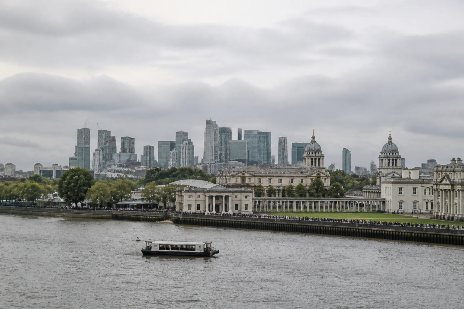 Representative cruise port destination view: Greenwich, United Kingdom; passenger waterfront and harbor water, not an exact landmark photograph.