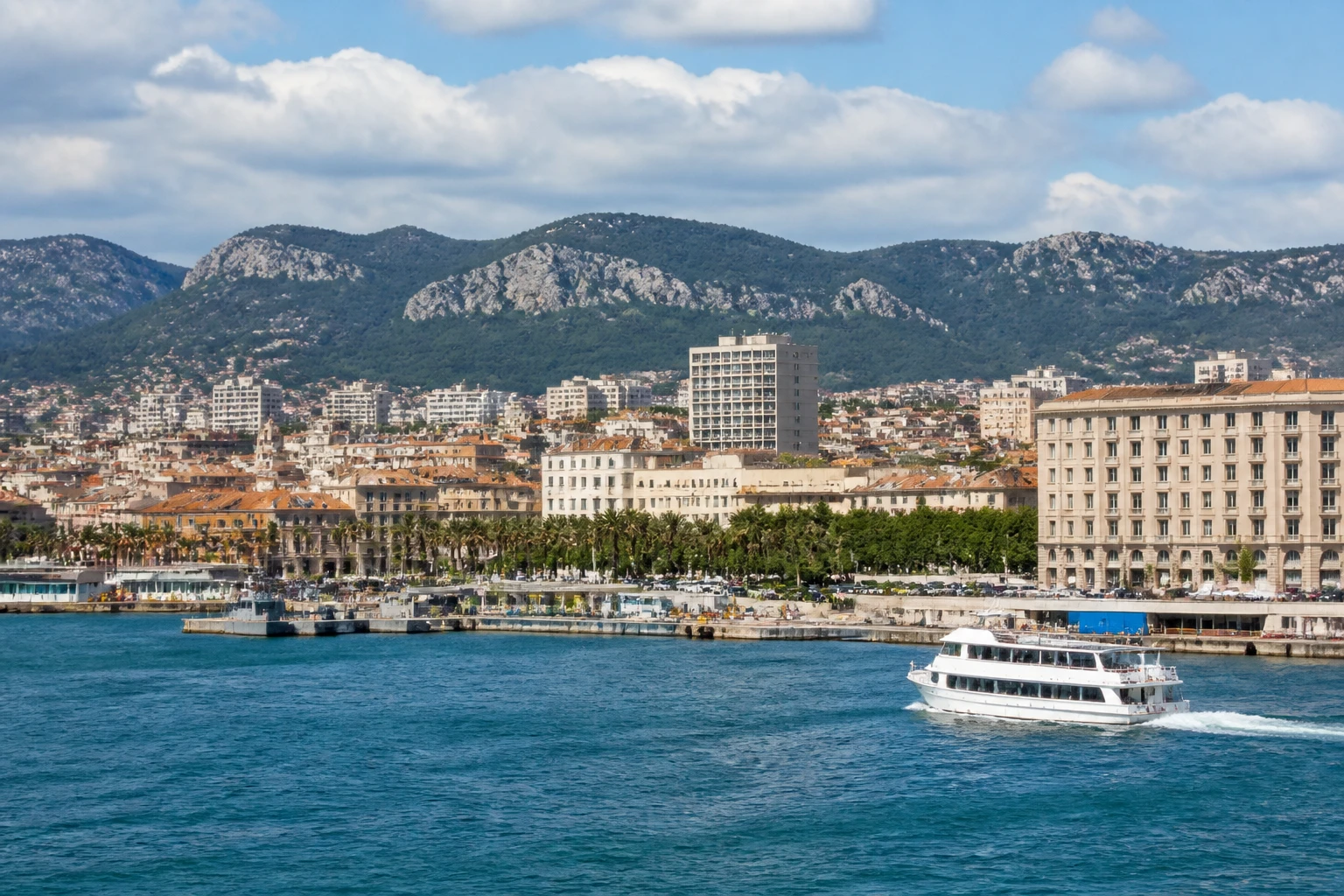Representative cruise port destination view: Toulon, France; passenger waterfront and harbor water, not an exact landmark photograph.