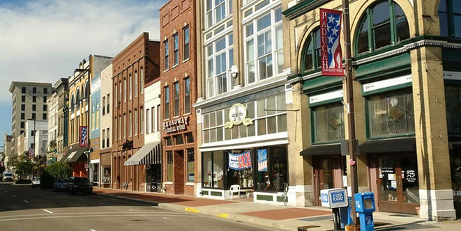 Brick storefronts and colorful historic buildings lining downtown Paducah, Kentucky.