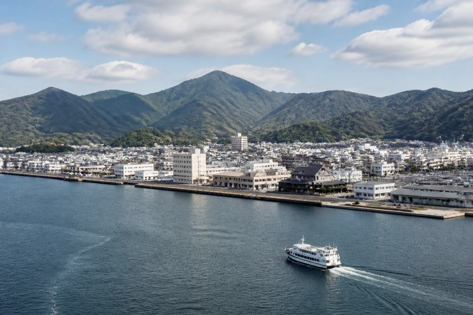 Representative cruise port destination view: Kumano, Japan; passenger waterfront and harbor water, not an exact landmark photograph.