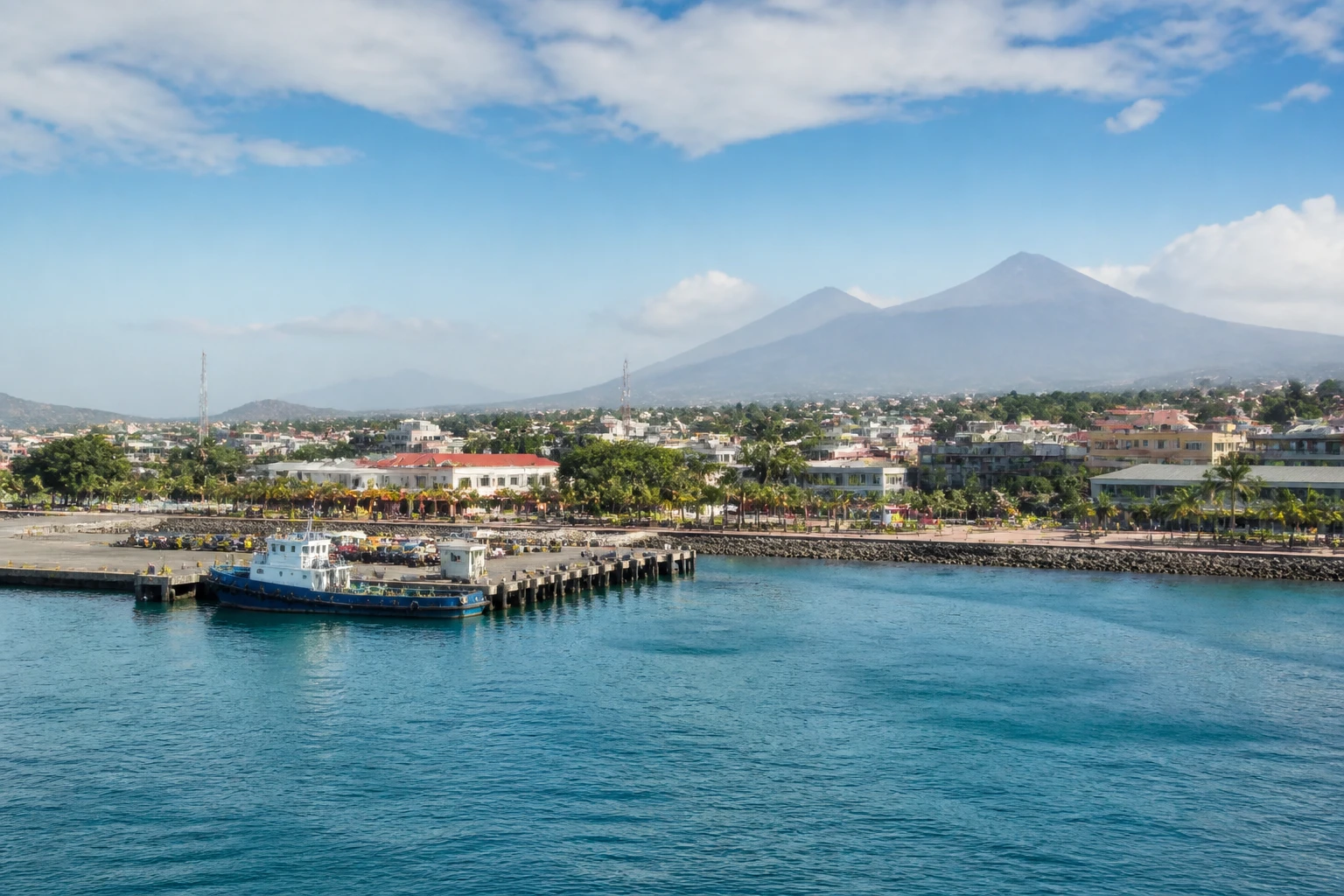 Representative cruise port destination view: Acajutla, El Salvador; passenger waterfront and harbor water, not an exact landmark photograph.