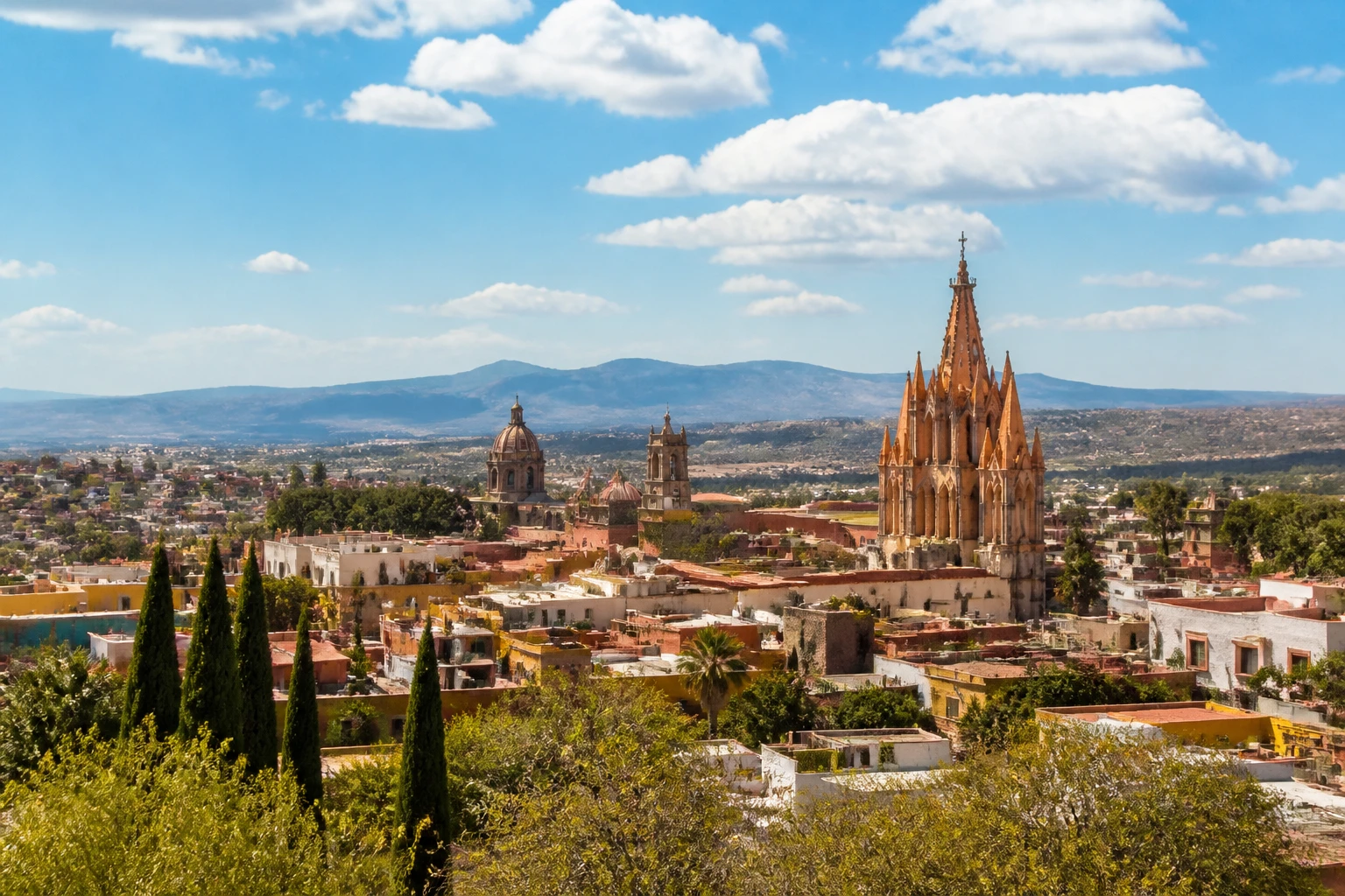 Representative city destination view: San Miguel de Allende, Mexico; heritage-scale streetscape and regional architecture, not an exact landmark photograph.