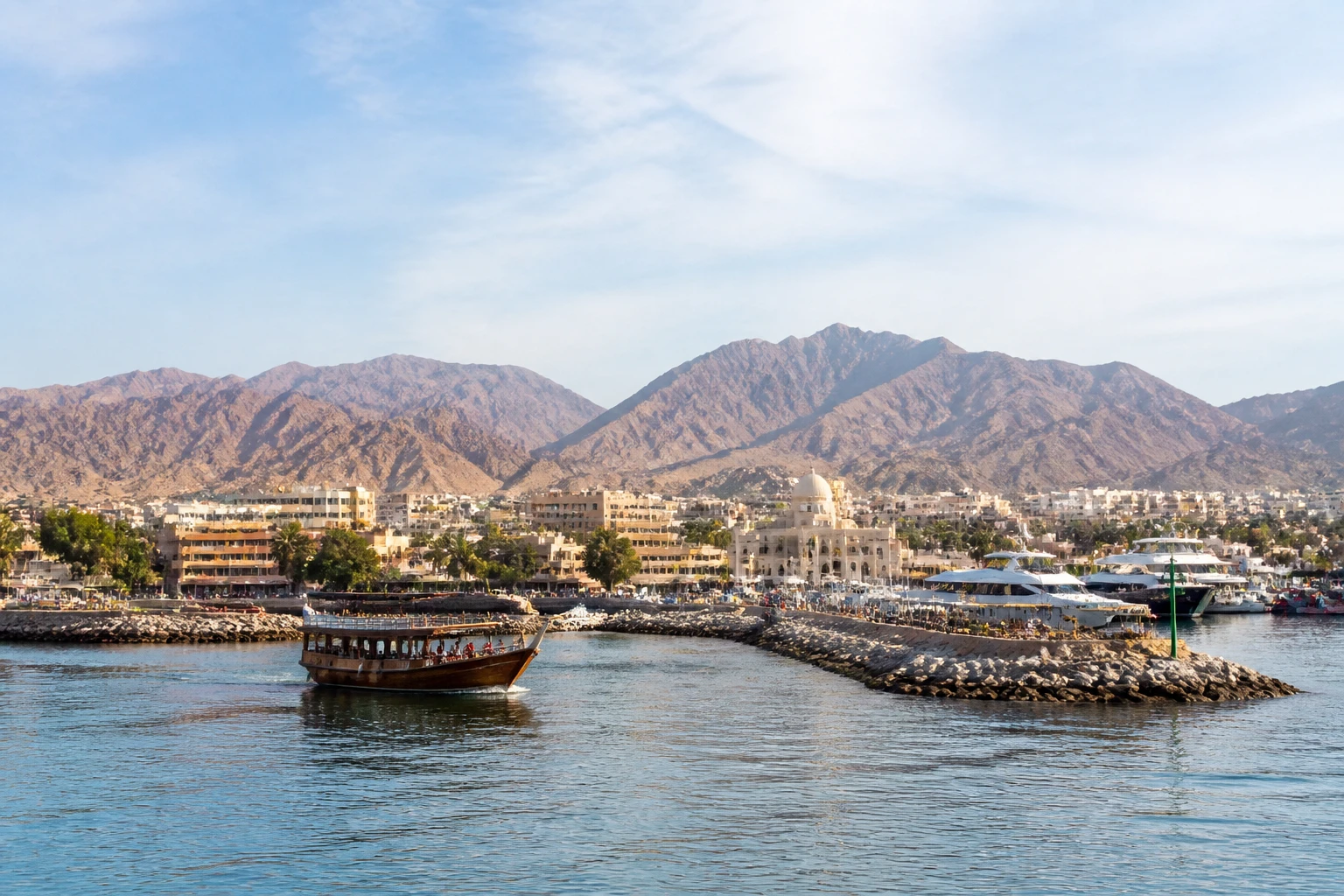 Representative cruise port destination view: Aqaba, Jordan; passenger waterfront and harbor water, not an exact landmark photograph.