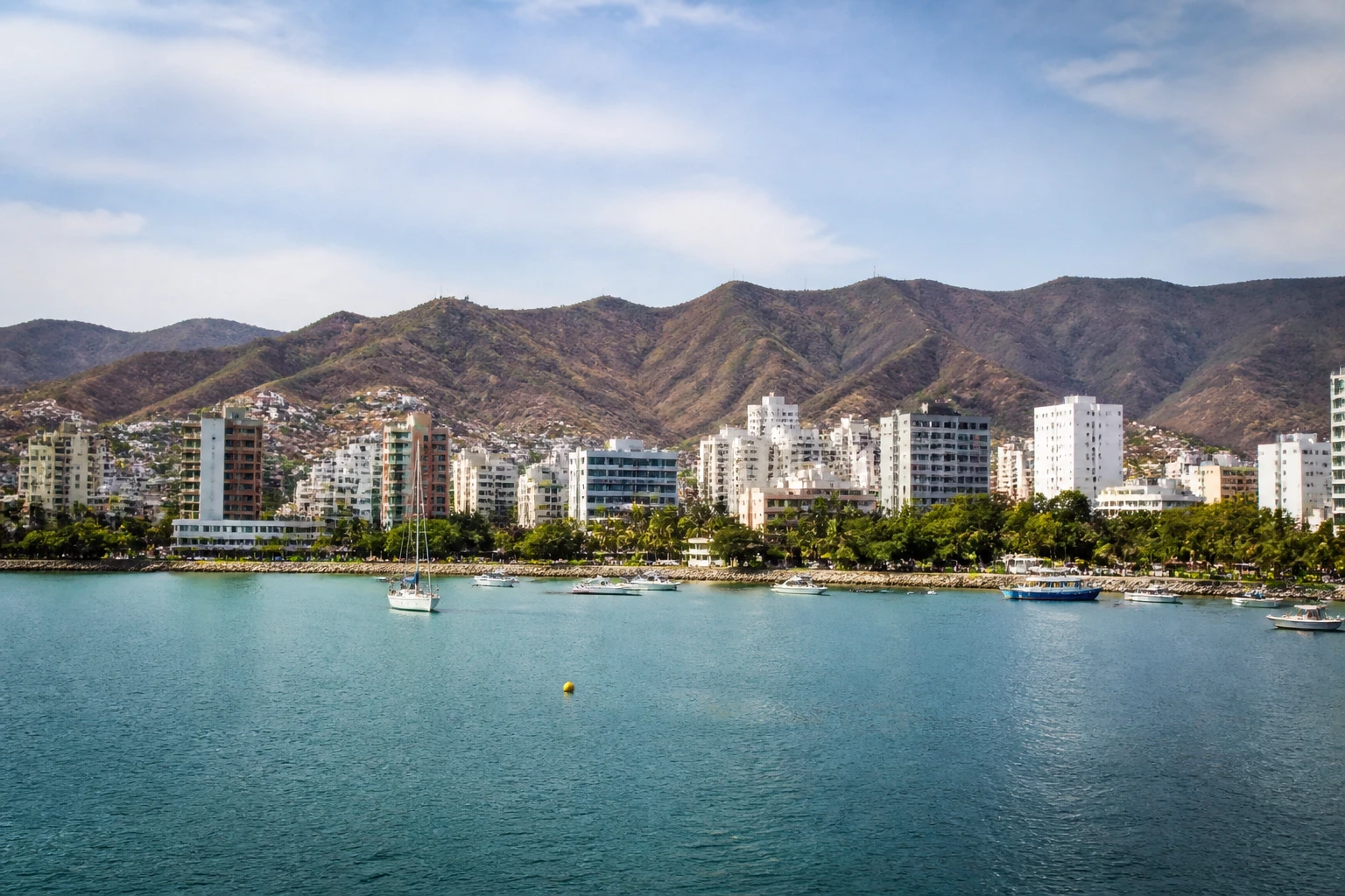 Representative cruise port destination view: Santa Marta, Colombia; passenger waterfront and harbor water, not an exact landmark photograph.