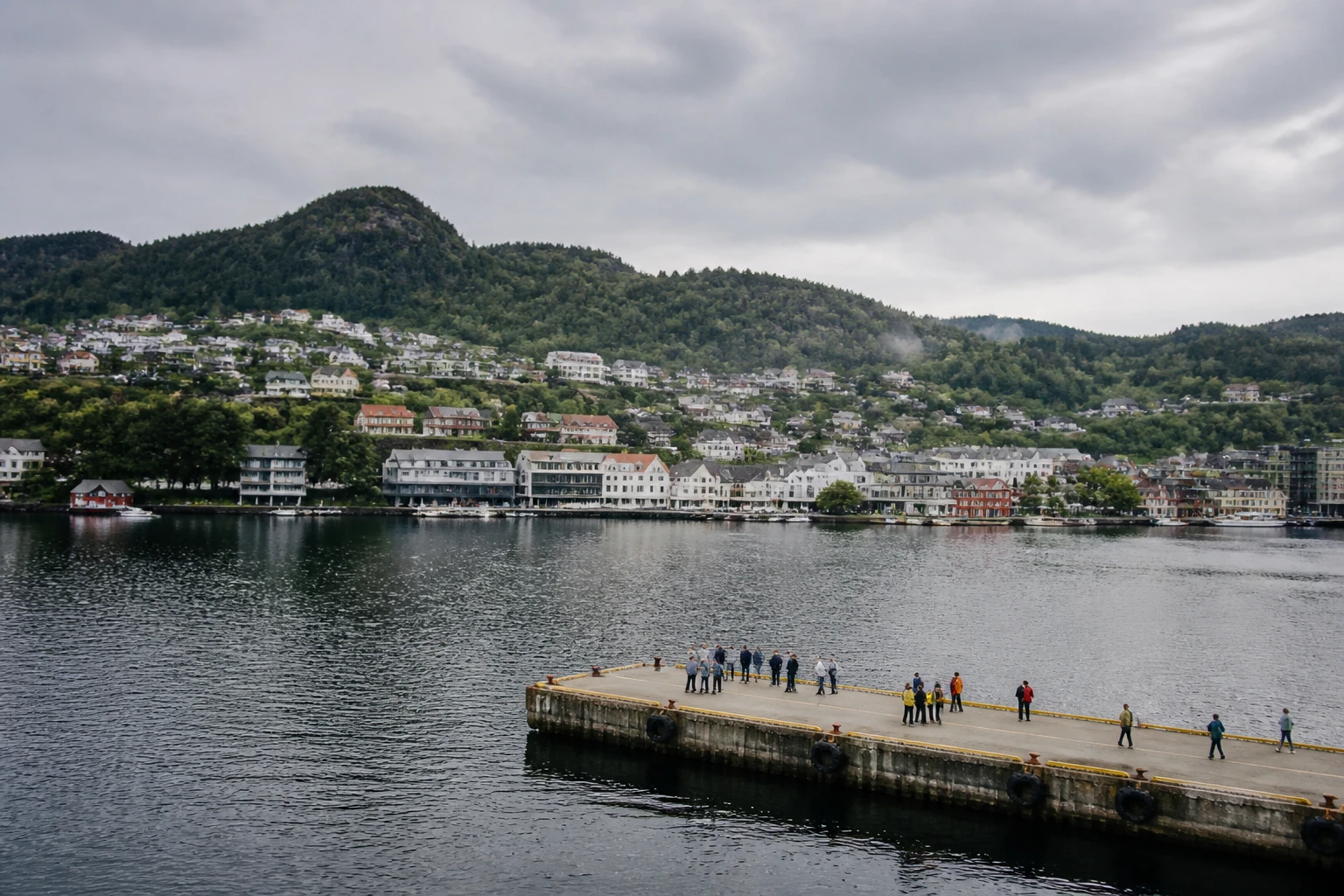 Representative cruise port destination view: Lyngdal, Norway; passenger waterfront and harbor water, not an exact landmark photograph.