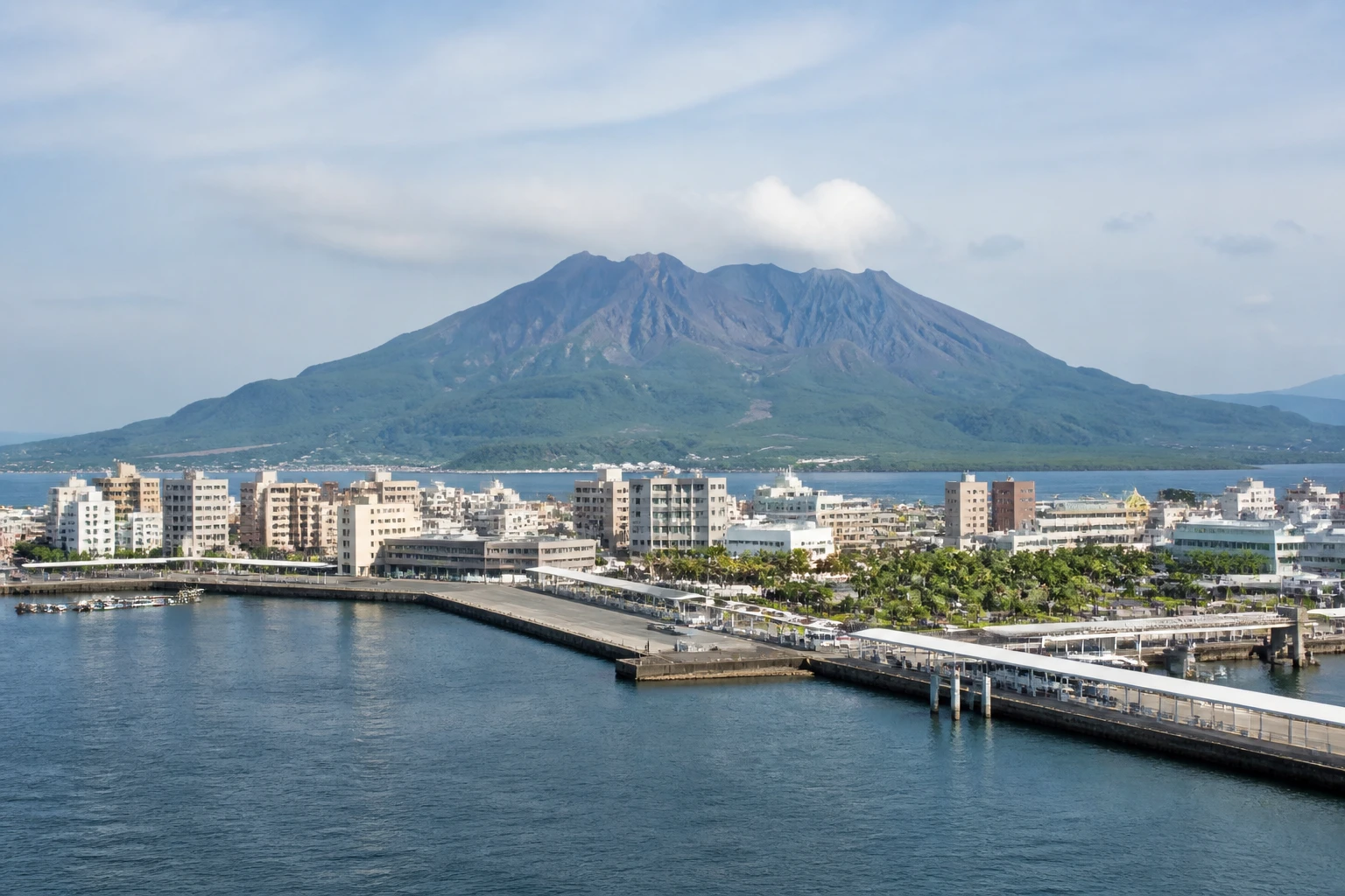 Representative cruise port destination view: Kagoshima, Japan; passenger waterfront and harbor water, not an exact landmark photograph.