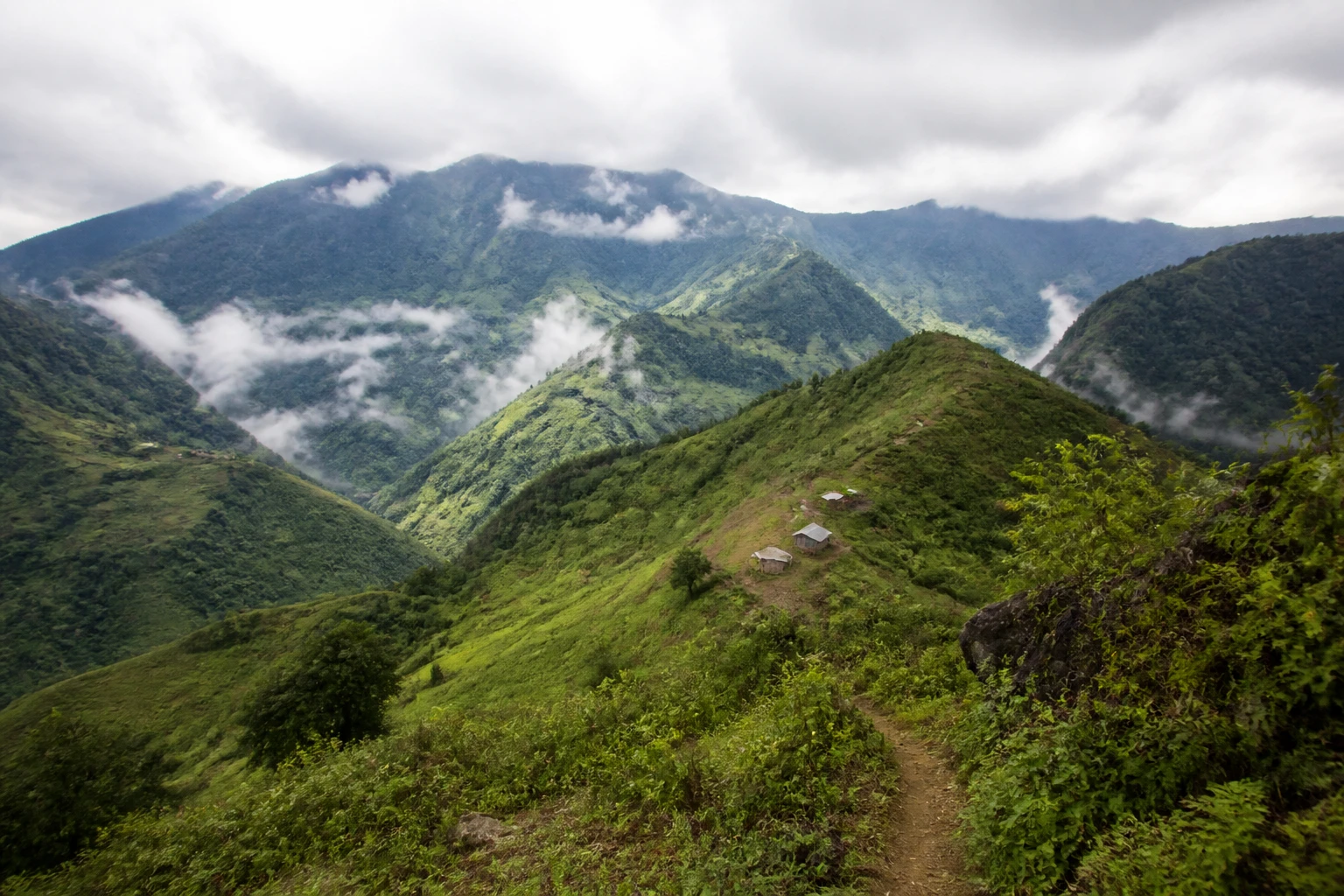 Representative mountain destination view: Sapa, Vietnam; mountain or canyon terrain and regional vegetation, not an exact landmark photograph.
