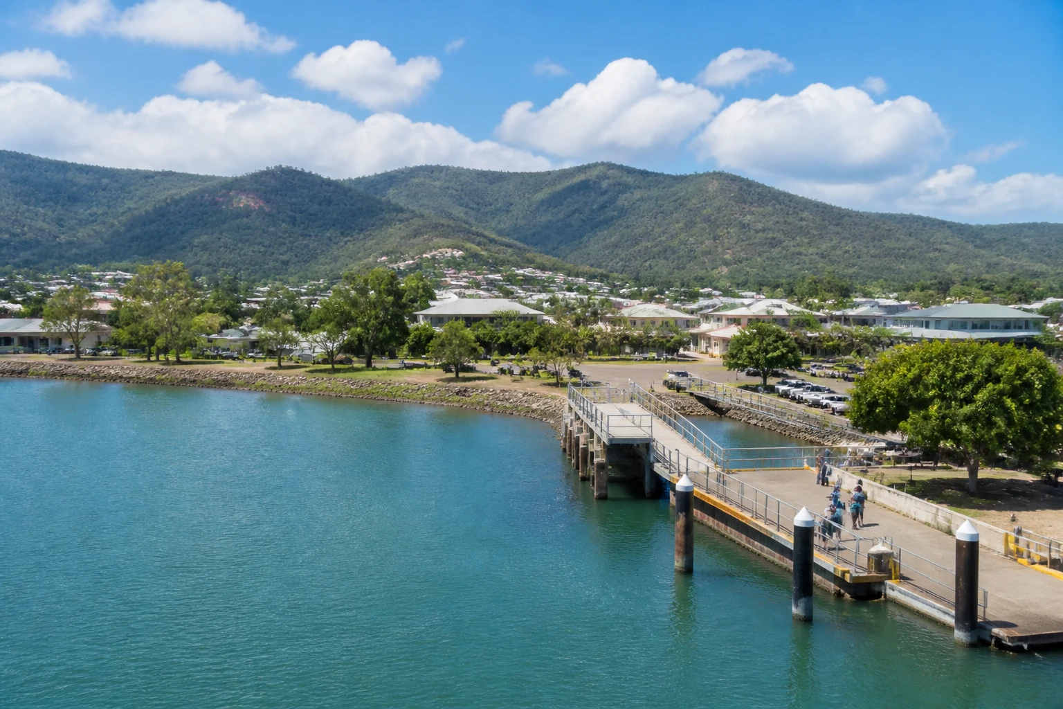 Representative cruise port destination view: Cooktown, Australia; passenger waterfront and harbor water, not an exact landmark photograph.