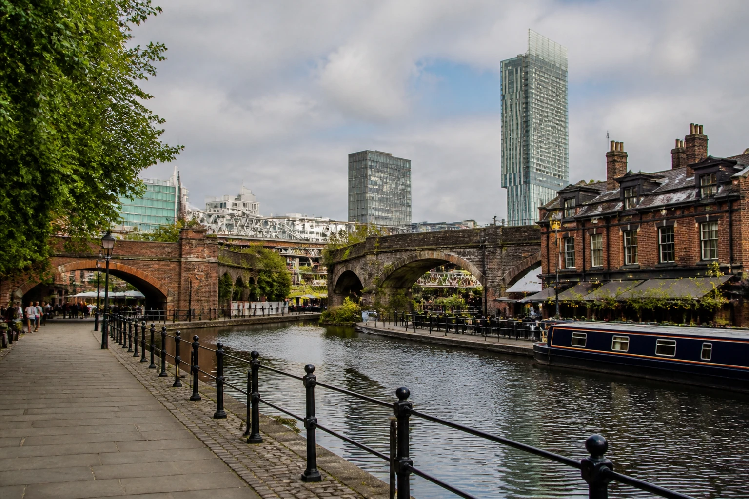 Representative city destination view: Manchester, United Kingdom; local streetscape and regional architecture, not an exact landmark photograph.