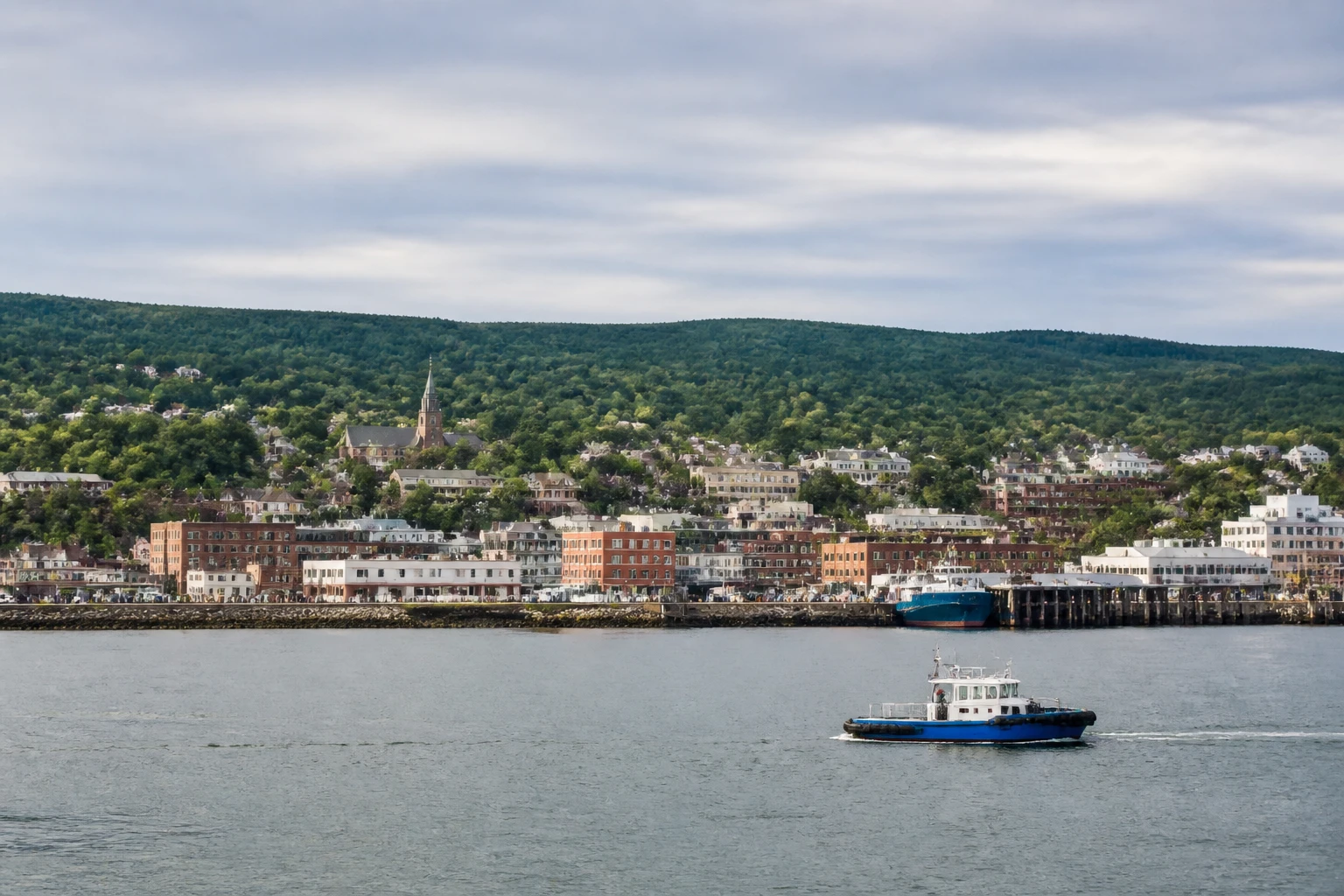 Representative cruise port destination view: La Baie, Canada; passenger waterfront and harbor water, not an exact landmark photograph.