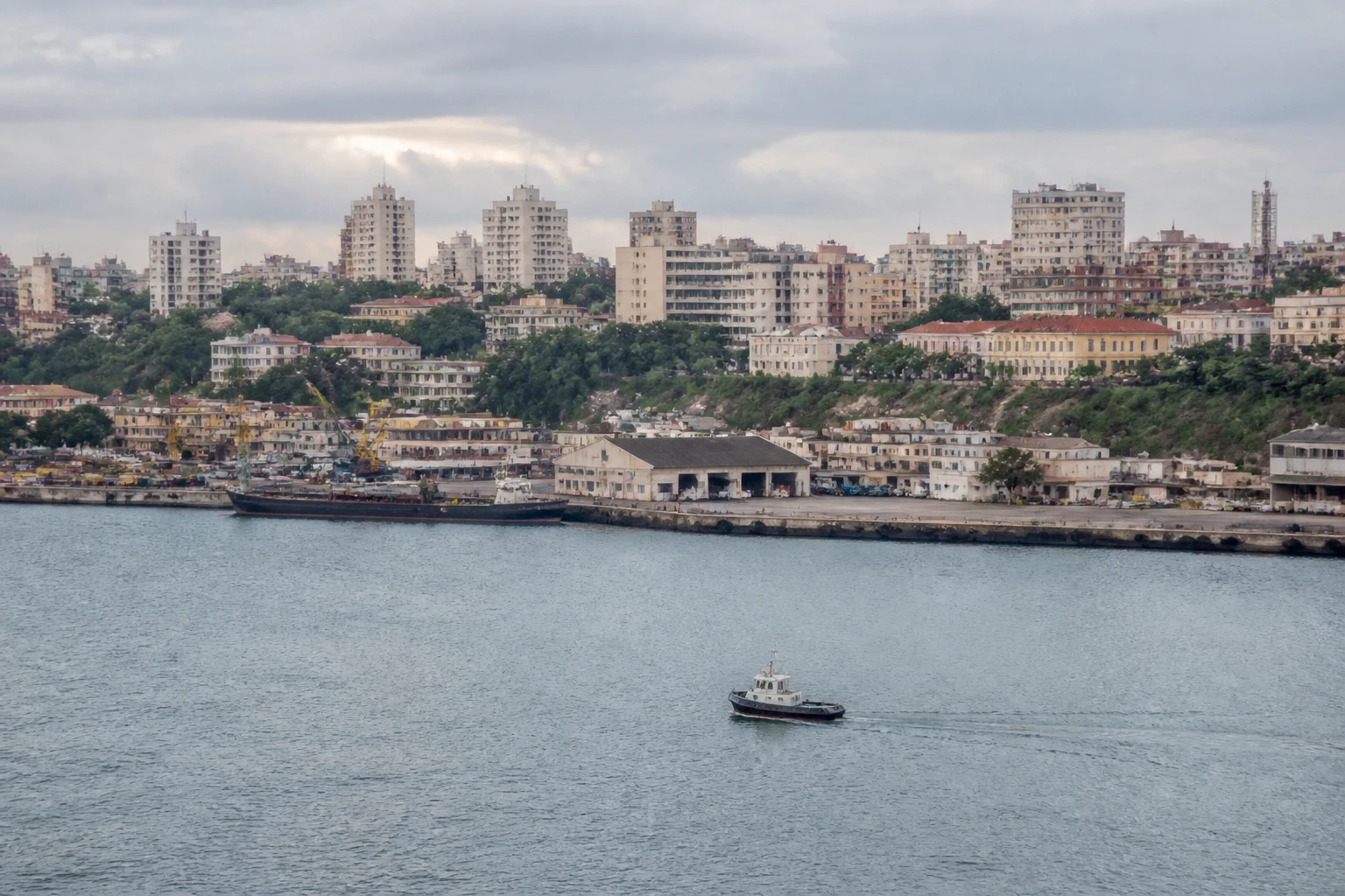 Representative cruise port destination view: Maputo, Mozambique; passenger waterfront and harbor water, not an exact landmark photograph.
