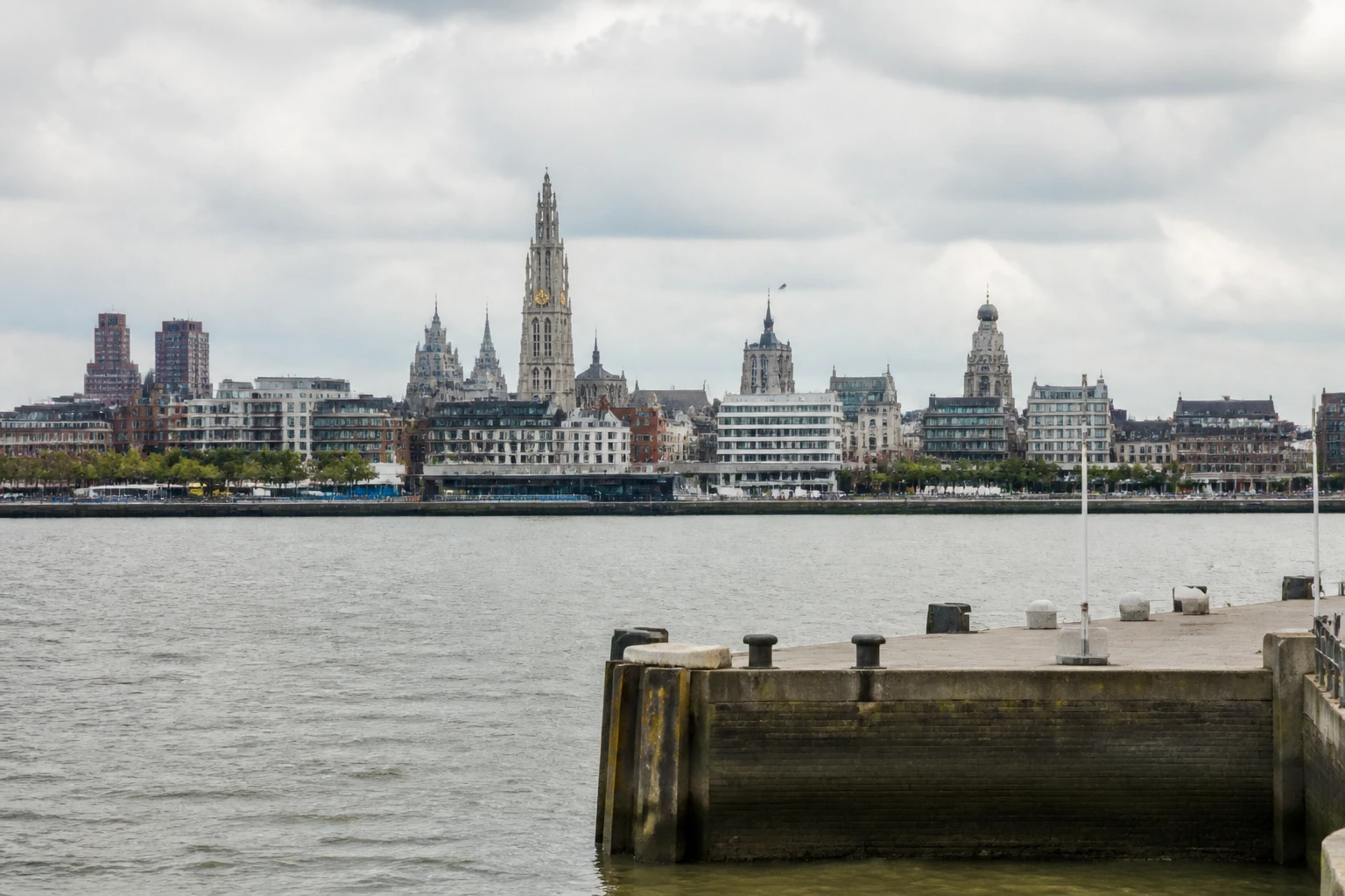Representative cruise port destination view: Antwerp, Belgium; passenger waterfront and harbor water, not an exact landmark photograph.