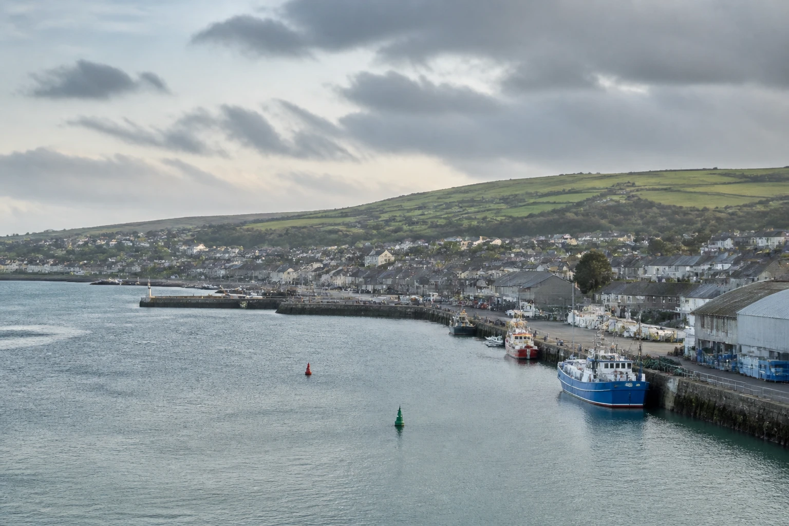 Representative cruise port destination view: Greencastle, Ireland; passenger waterfront and harbor water, not an exact landmark photograph.